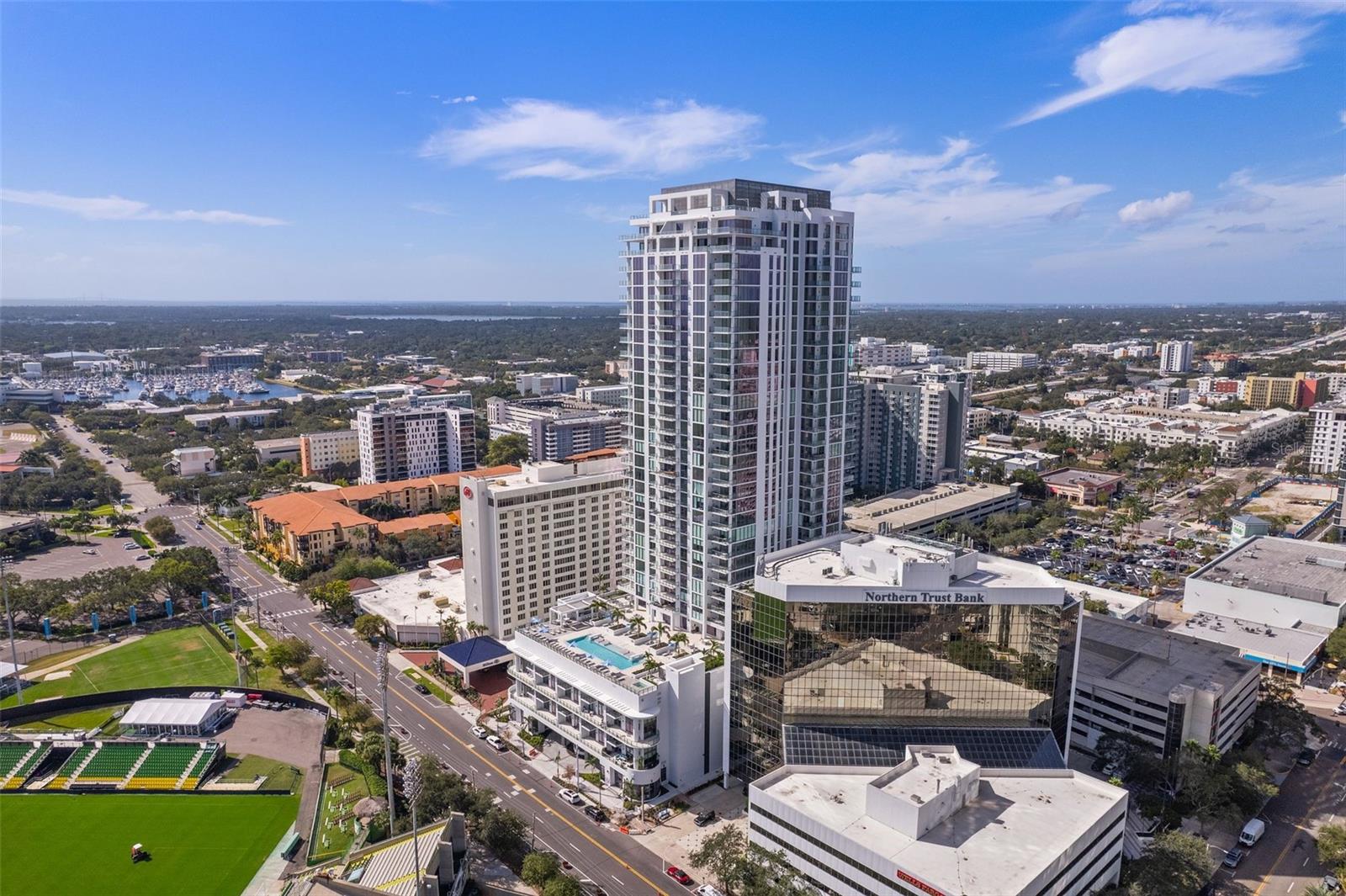 One or more photo(s) has been virtually staged. Welcome HOME... Unit 3001 at Saltaire. The latest luxury condominium in Downtown St Pete, where modern meets elegance meets convenience. The minute you walk in you are taken away by the breathtaking views this unit offers of the sun drenched blue waters of Tampa Bay. it is a corner unit at the upper floors of the building. The views cover East, South, where you see the sunshine skyway bridge all lit up at night and a partial western view where you can see the Gulf of Mexico in the distance. Wake up at dawn and watch the most spectacular sunrise with a warm cup of coffee in your hand. The kitchen, bathrooms, and the laundry room feature contemporary European style cabinetry. The open floor plan kitchen, living room and dining room with the balcony creates the ideal space to entertain your friends and family. This unit boasts 3 bedrooms with 3 en suite bathrooms. Each bedroom offers sweeping panoramic views of the water through wall to wall, floor to ceiling windows. The den can be transformed into a family room, a cozy library or a media center. You walk out to the balcony and you are greeted by downtown St Pete, Tampa bay, the Rowdies Stadium and Albert Whitted Airport. All for you to enjoy. The 7th floor deck offers a plethora of luxurious amenities any resident could dream of. A full fitness room, a pool deck with water views, a dog park, cabanas and BBQ stations. You can spend the whole day pampering yourself. As you drive up to the building a Porte Cochere awaits you with a valet attendant. There is a 24 hr concierge service tending to your needs. Secure premises for those who seek a peace of mind. It is a building where every little detail is thought of for your enjoyment. Call today to preview it.