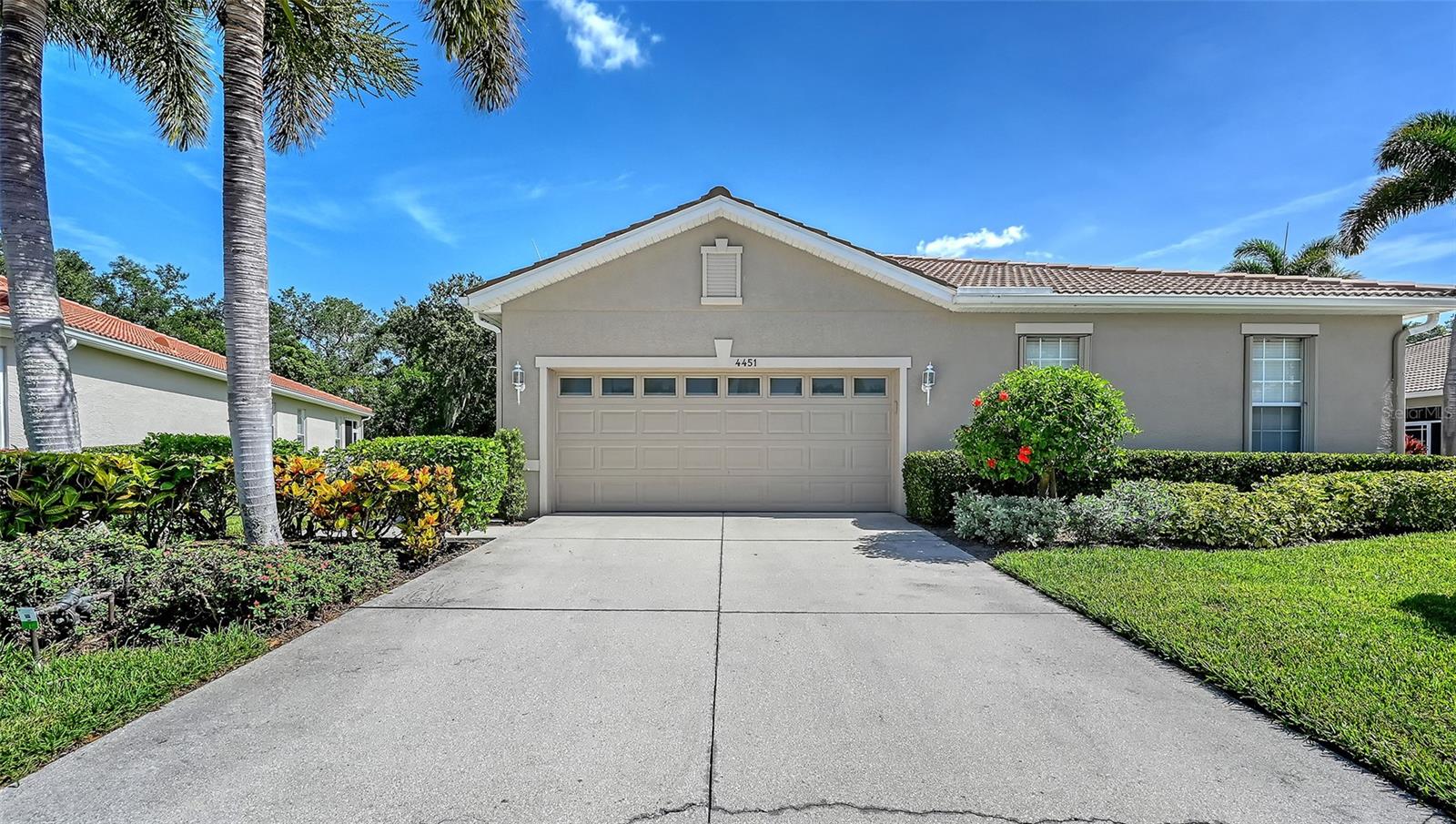 Beautifully updated paired villa with private preserve views. 2 bedrooms plus a den & 2 full baths. Hurricane windows & sliders for the lanai. Kitchen & bathroom cabinets are updated & granite counters. Kitchen features stainless appliances, gas stove. Gas hot water heater & stubbed for outdoor gas grill on lanai. Neutral tiles throughout living area, Freshly painted. Attached 2 car garage, Located near University Park area, mall & Mote Aquarium. This beautiful 55+ community is maintenance free & amenities include heated pool & spa, fitness, baci courts, clubhouse & more. This is a duplex villa not a fourplex. Furniture package available at additional cost