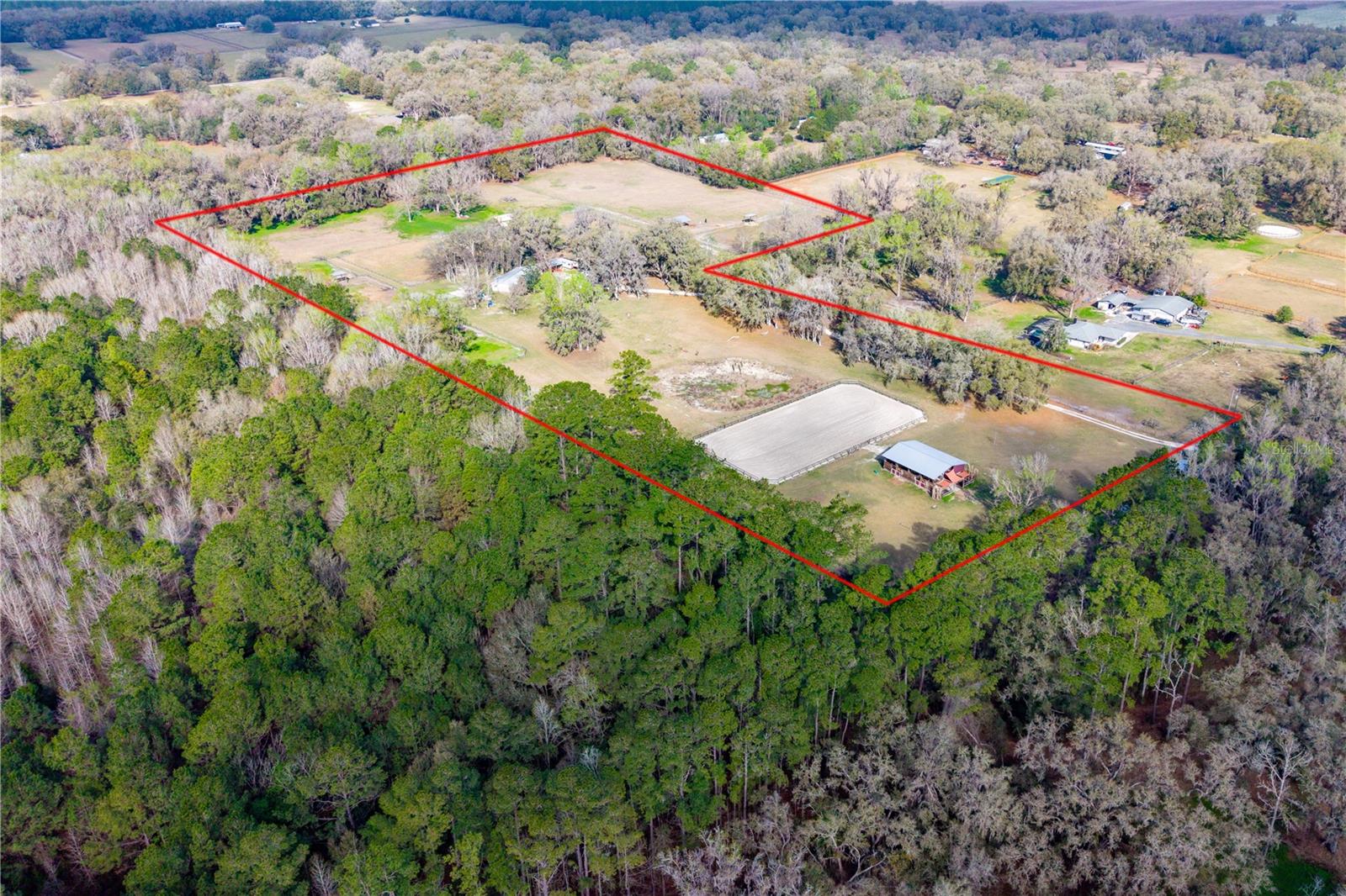 TURNKEY EQUESTRIAN FARM ON 18+ ACRES IN MARION COUNTY — MINUTES TO WEC & HITS OCALA

Positioned in one of North Central Florida’s most desirable equestrian regions, this fully equipped horse property offers the ideal setup for training, boarding, or private farm use just minutes from World Equestrian Center and HITS Ocala.

Designed with functionality and horse care in mind, the property features:
7 oversized stalls with center-aisle barn
12 paddocks for rotational grazing
Riding arena and round pen
Tack room, feed room, hay storage, and equipment space
Two wash racks and 50-amp hookup

The land showcases the natural beauty Florida horse country is known for, with mature oak trees, rolling pasture, pecan and fruit trees, shaded turnout areas, and a seasonal pond that adds to the property’s charm and usability.

The 3-bedroom, 2-bath home offers comfortable on-site living for owners, trainers, guests, or staff, with opportunity to personalize over time.

Whether you’re seeking a private equestrian retreat, income-producing boarding setup, or training facility near Ocala’s premier horse venues, this property offers exceptional functionality, acreage, and location in a highly sought-after area.