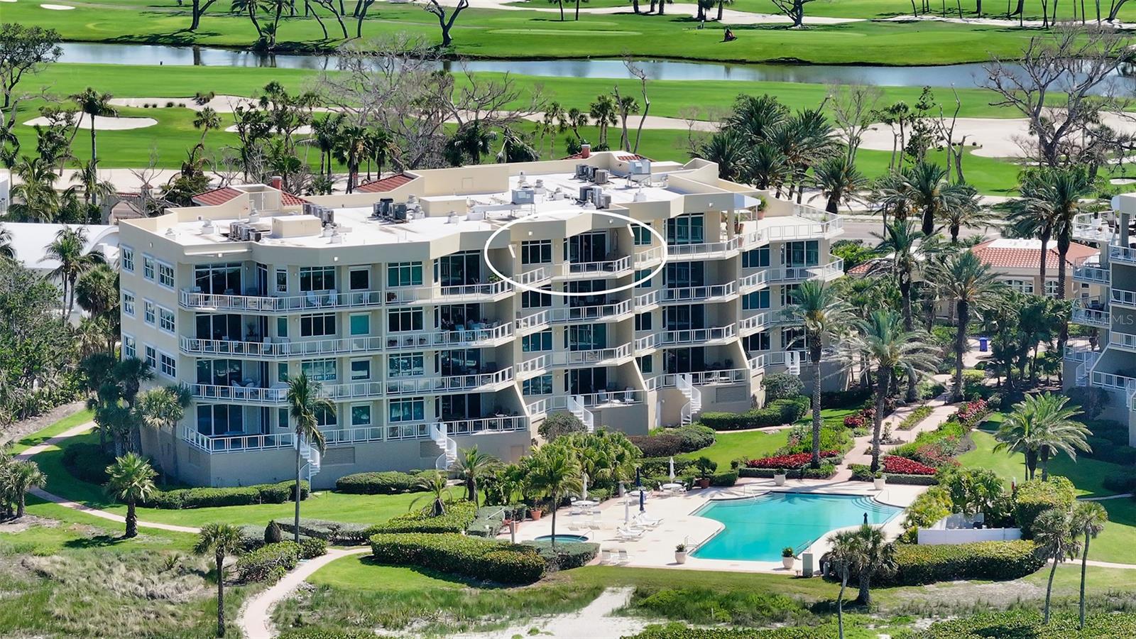 Experience the pinnacle of island living in this exquisite 3-bedroom, 3-bath penthouse at Villa di Lancia, a prestigious Gulf-front enclave on Longboat Key. One of only 38 residences in this gated, resort-style community, this rare offering boasts a 195 sq ft balcony with sweeping Gulf views—plus glimpses of Sarasota Bay and the downtown skyline. Meticulously maintained by the original owner and offered turnkey furnished, pride of ownership is evident throughout, and the timeless layout invites your vision for contemporary updates. The views from the main living area and primary suite are simply breathtaking, and there is a large covered portion of the balcony to provide shade if needed. The unit has a natural gas fireplace and cooktop, solid core doors, wood cabinetry and stone counters throughout, and a ceiling height of 9’ 9”. The second bedroom has a walk in closet and ensuite bathroom, plantation shutters, and expansive views across the golf course to Sarasota Bay. The third bedroom is currently used as a den, but could be easily restored to a third bedroom. It also has golf course and bay views. The kitchen is well designed with shaker style cabinetry, granite countertops,  a central island with pull out drawers and a planning desk, but there is good potential to expand or reimagine as desired.  Villa di Lancia residents enjoy direct beach access, lushly landscaped grounds, a staffed gatehouse, and an impressive suite of amenities: har-tru tennis courts (also striped for pickleball), a fitness center, sauna, resort-style pool, hot tub, and elegant clubhouse for social gatherings. Onsite property management, maintenance, and concierge-level services ensure carefree living. Just minutes from the world-class shopping and dining of St. Armands Circle and the vibrant arts scene of Downtown Sarasota, Villa di Lancia offers the perfect blend of privacy, luxury, and convenience. This unit has one assigned garage parking space which is deep enough to fit two vehicles and a private storage unit. EV charging station on site.