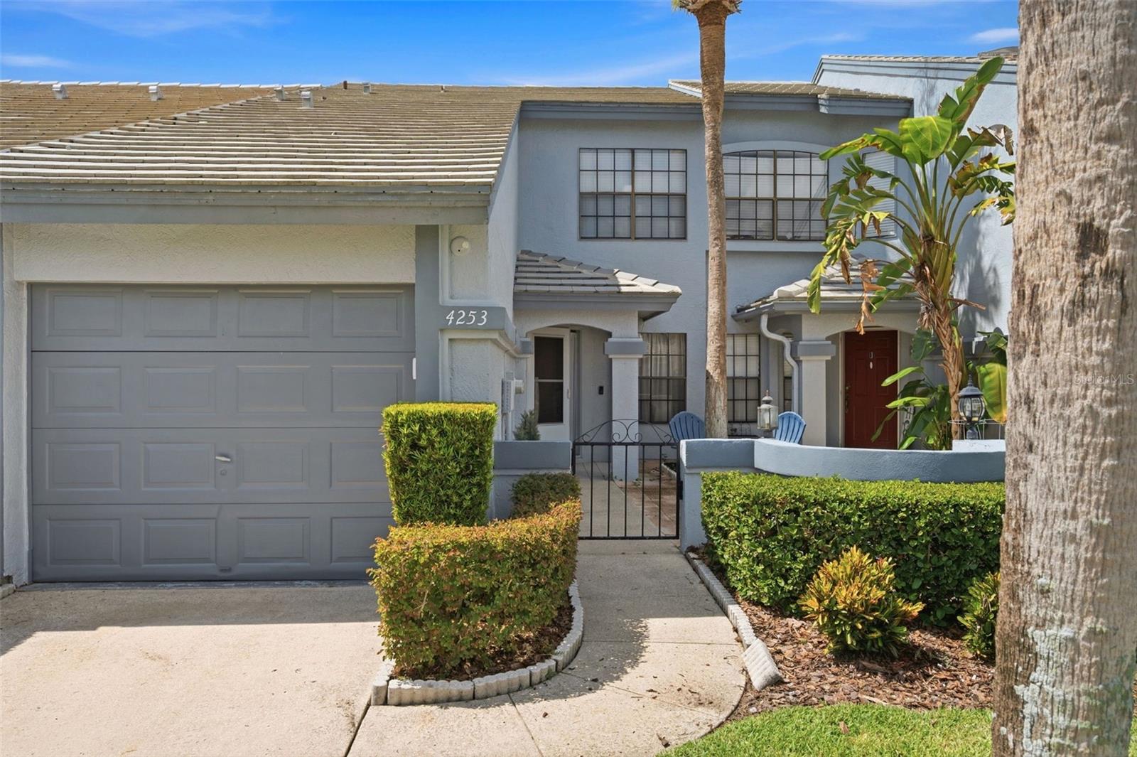 LOCATION! LOCATION! LOCATION! Welcome to this beautifully updated 2-bedroom, 2.5-bath townhome in the highly desirable Brentwood Park community of Carrollwood, offering some of the lowest HOA fees in the area! This move-in-ready home features an open-concept floor plan with beautiful wood-look tile flooring throughout the main living areas, neutral designer colors, updated lighting, and abundant natural light. The renovated kitchen boasts shaker-style cabinetry, stainless steel appliances, subway tile backsplash, an oversized breakfast bar, ample cabinet storage, and a modern farmhouse sink with a pull-down faucet. The spacious living area opens to a large screened lanai with a ceiling fan, perfect for relaxing or entertaining. Upstairs, you'll find generously sized bedrooms and updated bathrooms with modern vanities and fixtures. Additional features include an attached one-car garage, inside laundry with washer and dryer included, a Ecobee smart thermostat, an adorable private courtyard entry, modern hardware throughout, and plenty of storage. Enjoy low-maintenance living with HOA amenities that include a community pool, hot tub, and grounds maintenance. Conveniently located just minutes from the Veterans Expressway, St. Joseph's Hospital North, Whole Foods, Publix, Northdale YMCA, shopping, dining, and Tampa International Airport. This beautifully updated home offers the perfect combination of comfort, style, convenience, and value. Schedule your private showing today!