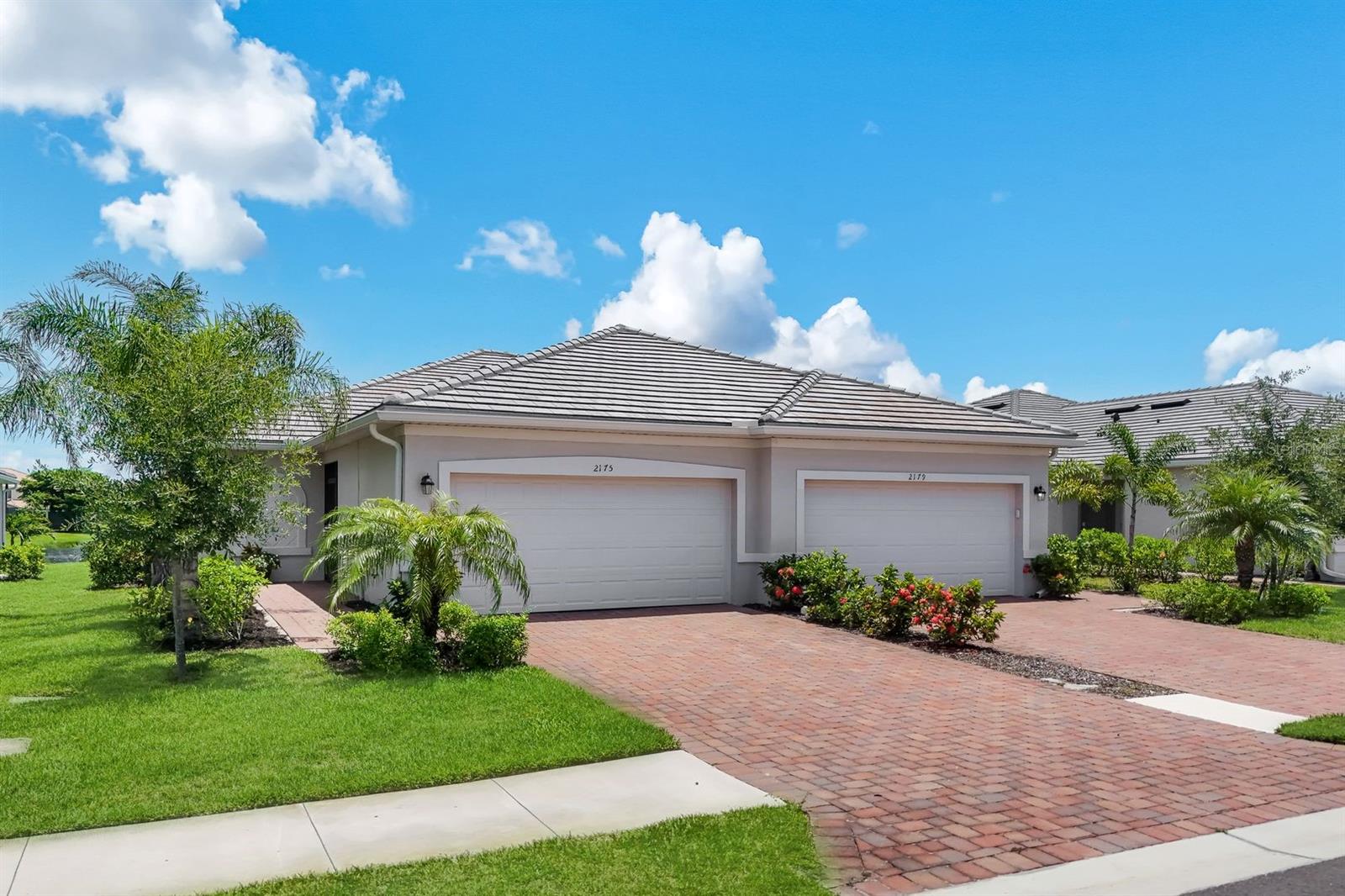 Virtually Staged. Beautiful and affordable "2 Year New" villa (Magnolia model) in the Groves at Orange Blossom, a gated community with pool and tennis/pickleball courts.  The Owners also have the use of the large clubhouse across Oil Well Road in the "Ranch" at Orange Blossom with amazing pool, fitness room, tennis courts and more!  With 3 bedrooms, 2 baths and a 2 car garage (epoxy flooring), this unit has a very nice Open Floor Plan.  The Owner has kept this home in immaculate condition and added upgrades such as whole house water filtration/water purification system, newly screened-in front porch, new cabinetry in the laundry room and pull out shelving in some kitchen cabinets.  The view of the pond from the great room and extended lanai is so peaceful and inviting!  There is a split bedroom feature, high ceilings and a 3rd bedroom (with closet) which can also be used as a home office with double door entry.  Best of all...a large kitchen with 42" cabinetry, solid surface countertops, large breakfast bar opening from kitchen to dining room.  All appliances inc: range, refrigerator, microwave, dishwasher, garbage disposal and full size washer and dryer!  Ready for immediate occupancy upon HOA approval!  The community has sidewalks throughout for those who like to exercise or just to take a nice stroll!  Just outside of the community are schools and a brand new "Publix" anchored shopping center with many new businesses opening up soon to service the new communities along Oil Well Road!