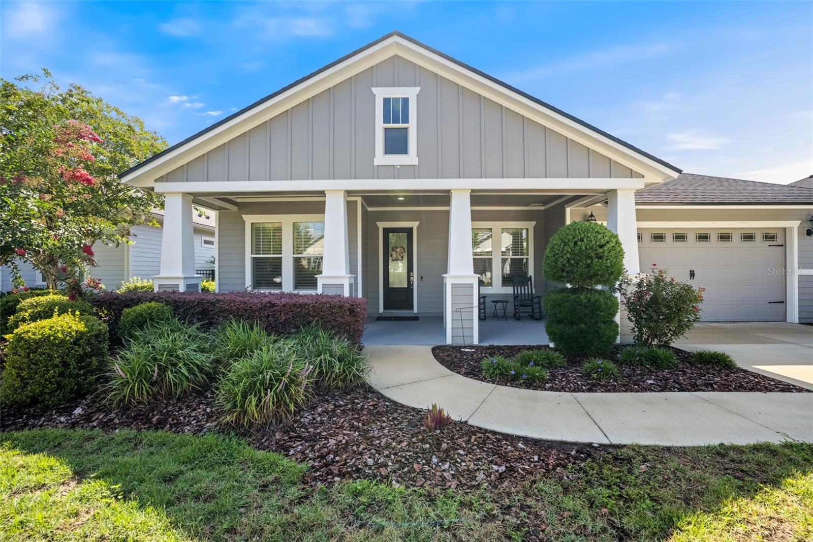 Welcome to Oakmont, one of Gainesville's most sought-after communities, where resort-style living meets exceptional design. Built by ICI Homes in 2016, this beautifully maintained 4-bedroom, 3-bathroom home with a dedicated study offers a highly desirable three-way split floor plan, providing privacy and comfort for every member of the household.

From the moment you arrive, you'll be captivated by the home's impressive curb appeal, highlighted by a spacious front patio, attractive architectural details, and lush landscaping. Step inside to an inviting foyer that opens to a formal dining room featuring an elegant tray ceiling, creating the perfect setting for entertaining and special occasions.

The heart of the home is the expansive kitchen, thoughtfully designed with abundant workspace, ample cabinetry, and seamless views of the spacious great room. Filled with natural light, the great room offers an open and welcoming atmosphere, complete with large sliding glass doors that extend your living space outdoors.

Retreat to the oversized screened lanai, where a stunning stone fireplace creates the perfect backdrop for year-round relaxation and entertaining. The private backyard is fully fenced and surrounded by mature hedges, offering a peaceful and secluded outdoor oasis.

The owner's suite enjoys its own private wing of the home, while the additional bedrooms are thoughtfully positioned throughout the split floor plan for maximum privacy. A dedicated study provides the ideal space for working from home, a library, or a hobby room.

Residents of Oakmont enjoy access to some of the finest amenities in Gainesville, including a grand clubhouse, heated resort-style pool with lap lanes and a children's fountain area, fitness center, pickleball courts, tennis courts, basketball courts, playgrounds, and beautifully maintained common areas.

This exceptional home combines thoughtful design, quality construction, and an unbeatable community lifestyle—all in one remarkable package.
