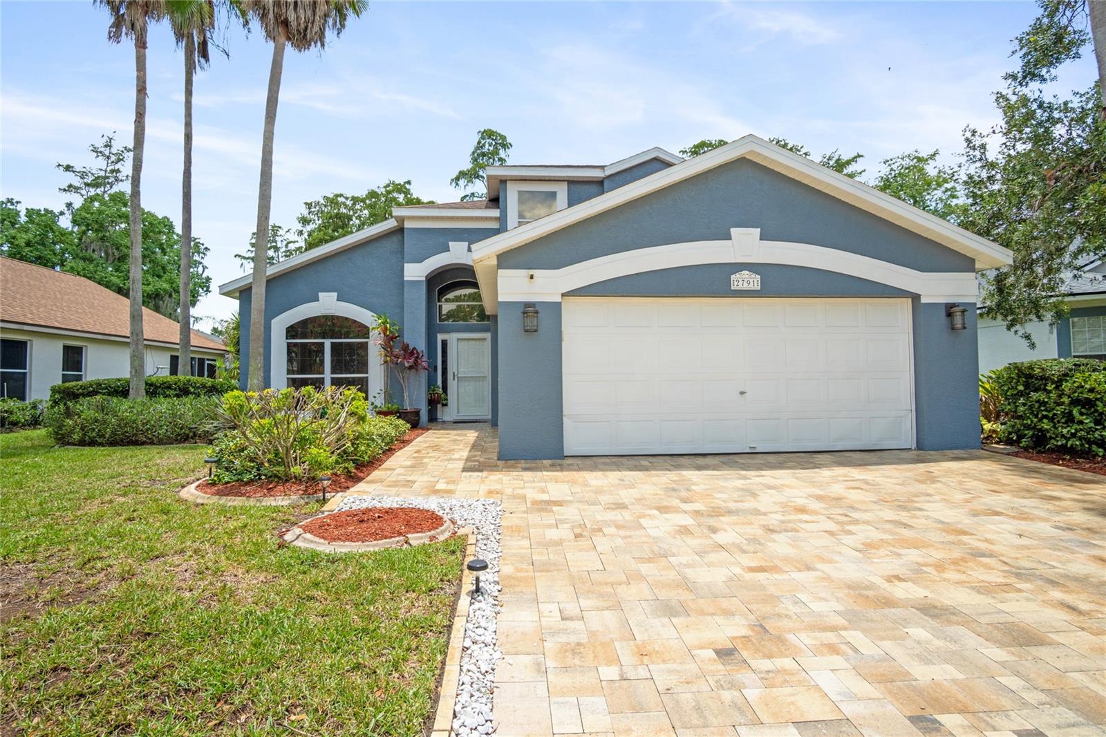 Welcome to this beautifully updated two-story pool home in the highly desirable Hunters Creek community, one of Orlando's most sought-after neighborhoods. Featuring 4 bedrooms, 2.5 bathrooms, and an exceptional location, this home offers the perfect combination of comfort, style, and convenience.

As you enter the home, you'll be welcomed by soaring high ceilings, abundant natural light, and elegant formal living and dining rooms that create an inviting space for entertaining. The first floor features laminate and tile flooring throughout, while French doors open to the screened pool area, where you can relax and enjoy stunning golf course views. The home's curb appeal is enhanced by a newly installed paver driveway, creating a beautiful first impression.

The spacious first-floor primary suite offers a private retreat with a beautifully renovated en-suite bathroom featuring dual vanities, a walk-in shower, a separate soaking tub, and a large walk-in closet. The main level also includes a convenient half bath and a dedicated laundry room.

Upstairs, you'll find three generously sized bedrooms and a fully renovated bathroom with dual vanities, providing plenty of space for family and guests.

This home has been thoughtfully updated for peace of mind, including a complete repipe, a one-year-old A/C system, new kitchen appliances, a recently resurfaced pool, and fresh interior and exterior paint, making it truly move-in ready.

Enjoy tranquil pond views from the front of the home and picturesque golf course views from the backyard. Located within walking distance of shopping, restaurants, and everyday conveniences, and just minutes from State Road 417 and Orlando International Airport, this home offers an unbeatable lifestyle in an excellent location.

Don't miss the opportunity to own this exceptional Hunters Creek home, where beautiful views, quality updates, and everyday convenience come together in one remarkable property.