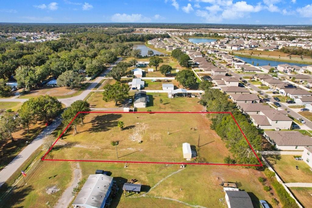 ***House plans available. Build what was in mind or something entirely different. Ask for details.*** Best valued vacant land parcel in Lakeland. Cleared, Well & Septic, Impact fees covered*** Welcome to 4005 Timberwood Drive. An exceptional high and dry 1.08-acre cleared homesite positioned in one of South Lakeland’s most convenient and desirable areas with no HOA or CDD Fees. This thoughtfully prepared parcel is truly turnkey, featuring a brand-new storage shed, plus an operational well and septic system, giving future owners a tremendous head start on construction. With impact fees already paid for over three years, significant upfront costs are eliminated, making this one of the most value-packed land opportunities on the market. Whether you envision a custom-built residence or prefer the versatility of a quality mobile home, this property accommodates both. The expansive acreage offers space for outdoor living, workshops, gardens, or simply room to enjoy the privacy and quiet that Timberwood Dr provides. Perfectly positioned near everyday essentials and major thoroughfares, the location offers the ideal blend of peaceful rural surroundings with quick access to Lakeland’s shopping, dining, and commuter routes. This is the land that lets your vision come to life - ready, cleared, and waiting for its next owner.