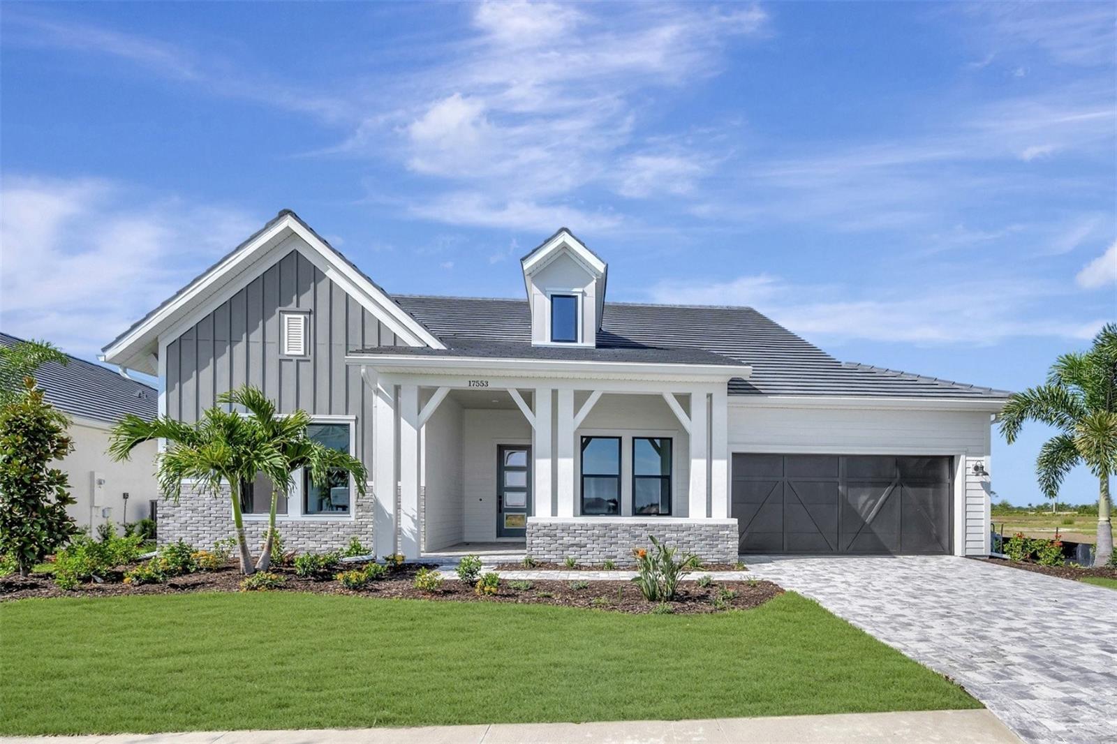 Experience luxury living in the Brendlyn - Executive Series, a thoughtfully designed 4-bedroom, 3 full bath, 1 powder bath home with an additional dedicated pool bath, offering 3,271 square feet of elegant living space. Situated on a desirable south-facing homesite with serene lake views, this home is filled with natural light from expansive windows and enhanced by an elevated ceiling in the family room with transom windows for added architectural appeal.

The open-concept layout features a spacious family room, an inviting open den, and a gourmet kitchen equipped with a wall oven, built-in microwave, and a convenient butler’s pantry—perfect for entertaining.

The owner’s retreat is a true sanctuary, complete with a mudroom connection to the laundry area and massive, oversized his-and-hers closets. Secondary bedrooms are well-appointed, with one set connected by a Jack-and-Jill bath, while the remaining bedrooms each enjoy private en-suite baths.

Step outside to your private outdoor oasis featuring a pool and spa, extended lanai, and a fully equipped outdoor kitchen with hood—ideal for enjoying Florida living year-round. Completing the home is a 4-stall garage with a 2-car tandem configuration, offering ample storage and flexibility.

As a resident of Palmera Wellen Park, your lifestyle is immediately elevated. Lawn maintenance is taken care of, giving you more time to enjoy resort-style amenities like the sparkling pool, clubhouse restaurant, modern fitness center, golf simulator, dog park, trails, and pickleball courts. With a full-time lifestyle director, there's always an exciting event on the calendar. Plus, you’ll benefit from hurricane-impact windows and a natural gas community.