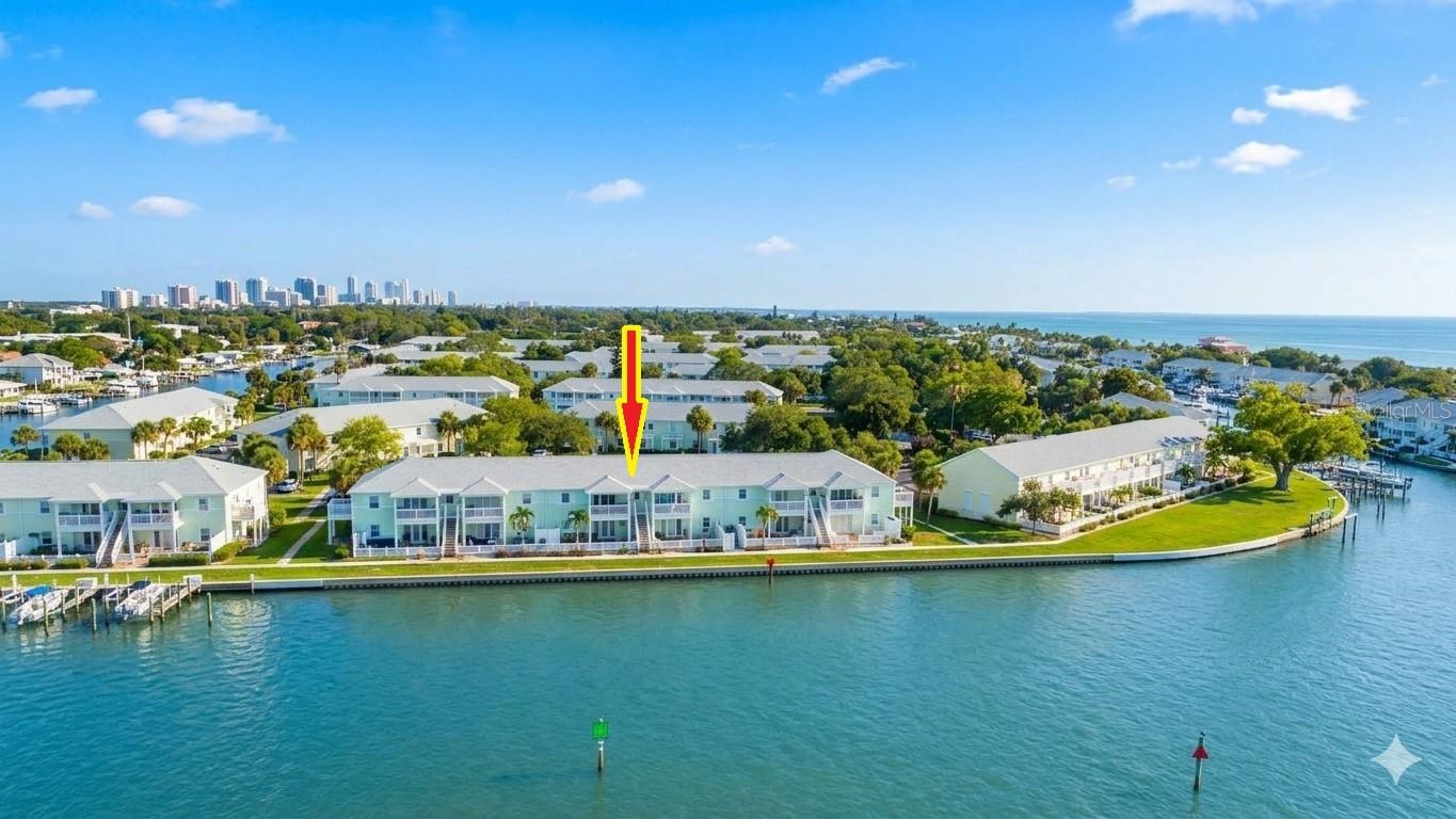 Experience the ultimate coastal lifestyle in this pristine, high-and-dry waterfront condo. Perched safely on the second floor, this 2-bedroom, 1-bathroom residence boasts rare, unobstructed panoramic views of Tampa Bay and the iconic Sunshine Skyway Bridge. Wake up to majestic sunrises over the water from your private balcony, and wind down with stunning sunset views on the other side.The interior is bathed in natural light, featuring fresh paint, a neutral color palette, and brand-new waterproof luxury vinyl flooring throughout. Absolute peace of mind comes standard: this unit suffered zero storm damage, and features recently installed hurricane impact windows, a 2022 roof, 2024 exterior paint, and a new washer and dryer.Step outside into an outdoor paradise. Cast a line in a backyard fishing spot so legendary that local boats crowd the area, or launch your kayak across Little Bayou to explore the nature preserve and mingle with dolphins at the nearby sandbar.Located in a resort-style community, you will enjoy access to two pools, a workout facility, and athletic courts for pickleball, tennis, basketball, volleyball, EV Stations and for the pet lovers a dogpark. Socialize at the exclusive Yacht Club, featuring a full bar, clubhouse, and daily activities—all just minutes from the popular Downtown St Pete on the Bayside or world-class Gulf beaches on the Gulf side! This isn’t just a home; it’s a lifestyle.