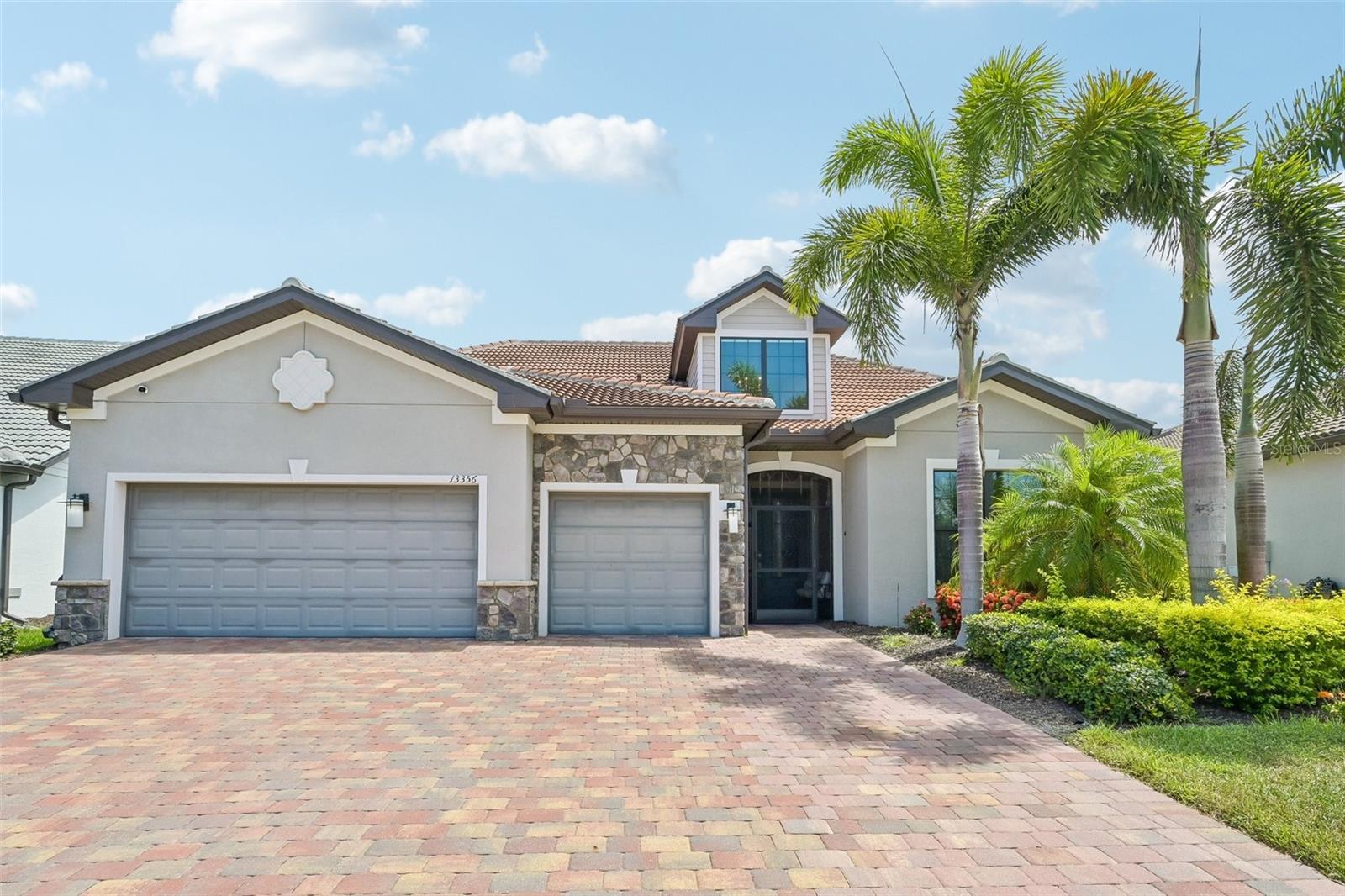 MOVE IN READY and extensively upgraded, this exceptional lakefront residence offers nearly 3,900 square feet of living space with 4 bedrooms, 4 full bathrooms, a dedicated office, an expansive second floor bonus room, a private pool and spa, an extended 3 car garage, and spectacular long lake views in the highly sought after gated community of IslandWalk at West Villages.

An impressive two story foyer welcomes you into a thoughtfully designed floor plan highlighted by a 12 foot coffered ceiling in the great room, 10 foot ceilings throughout the main living areas, 8 foot interior doors, custom 24 inch tile flooring, crown molding throughout, and new hardwood flooring. Electric roll down sunshades in the great room provide added comfort while framing beautiful views of the lake.

The gourmet kitchen was designed with both style and functionality in mind, featuring 52 inch wood cabinetry, granite countertops, a large center island, a walk in pantry with custom shelving, abundant cabinet storage, and an adjacent dining area ideal for everyday living or entertaining. A central vacuum system with a convenient kitchen sweep station adds everyday convenience.

The spacious first floor primary suite enjoys peaceful lake views and features custom shelving in the walk in closet along with a beautifully appointed en suite bathroom. Two additional guest bedrooms on the first floor each include their own private bathroom, while the dedicated office offers a quiet workspace. Upstairs, nearly 1,000 square feet of additional living space includes a large bonus room, a fourth bedroom, a full bathroom, and its own dedicated air conditioning system, creating exceptional flexibility for guests or additional living space.

Outdoor living is equally impressive. The screened lakefront lanai features a resurfaced pool and spa with convenient interior control system, a stainless outdoor kitchen, dedicated lanai air conditioning, a repaved paver lanai and pool deck, electric Kevlar storm screens, an electric hurricane shutter, and electric blinds that create a seamless indoor and outdoor living experience while maximizing the beautiful water views.

Extensive updates and improvements make this home completely move in ready. New hardwood flooring and a new staircase complement the home's timeless finishes. All windows and doors are hurricane impact rated. The smart plumbing system provides leak detection and allows remote water shutoff from your smartphone. Every sink has been replumbed with braided water supply lines for added reliability.

The oversized garage has been extended by four feet and includes dedicated air conditioning, added insulation, ceiling mounted storage, additional built in storage, and an epoxy finished floor. Completing the exterior is a paver driveway and sidewalk that enhance the home's outstanding curb appeal.

IslandWalk at West Villages offers an exceptional lifestyle with two amenity centers featuring resort style and lap pools, fitness centers, tennis courts, pickleball, bocce, walking and biking trails, playgrounds, and an active social calendar. Conveniently located near Downtown Venice, Gulf beaches, shopping, dining, golf courses, medical facilities, and CoolToday Park,