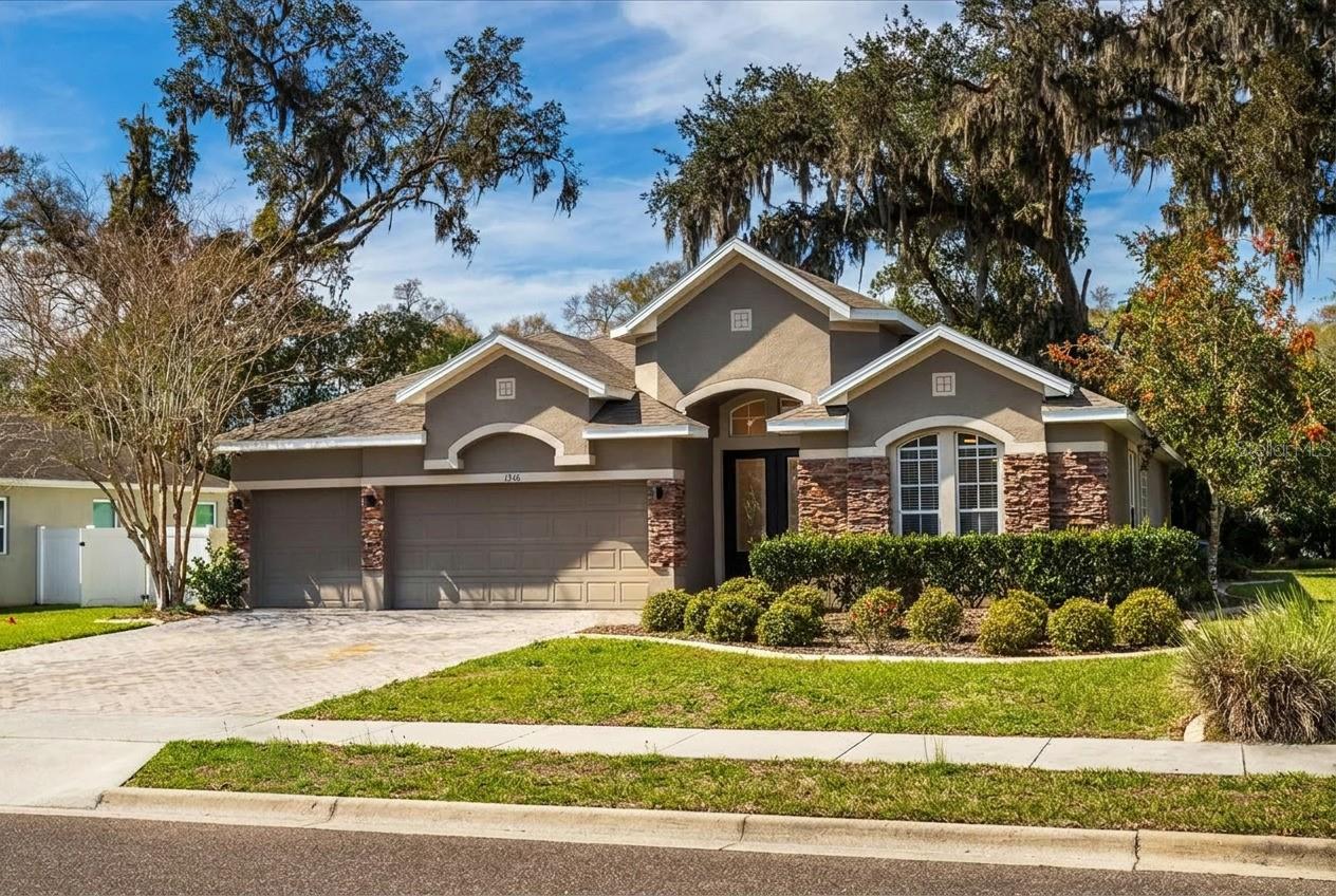 Short Sale. Welcome to this 4-bedroom, 3-bath single-family home in Ridgewood Crossing, DeLand — built 2007, 2,617 sq ft on a 9,344 sq ft homesite. Solar panels by Momentum Solar are fully owned and paid off, helping keep electric bills as low as $30/month. Recent upgrades include a 2022 roof, newer AC, 2-year-old gutters, kitchen renovation with quartz countertops throughout, and quartz/marble surfaces in all three bathrooms. The professionally landscaped backyard features fruit trees, flowering plants, a 6-person hot tub, and a wooded buffer for added privacy — no neighbor on the left side. Just 7 minutes to historic downtown DeLand and 15 minutes to Blue Spring State Park.