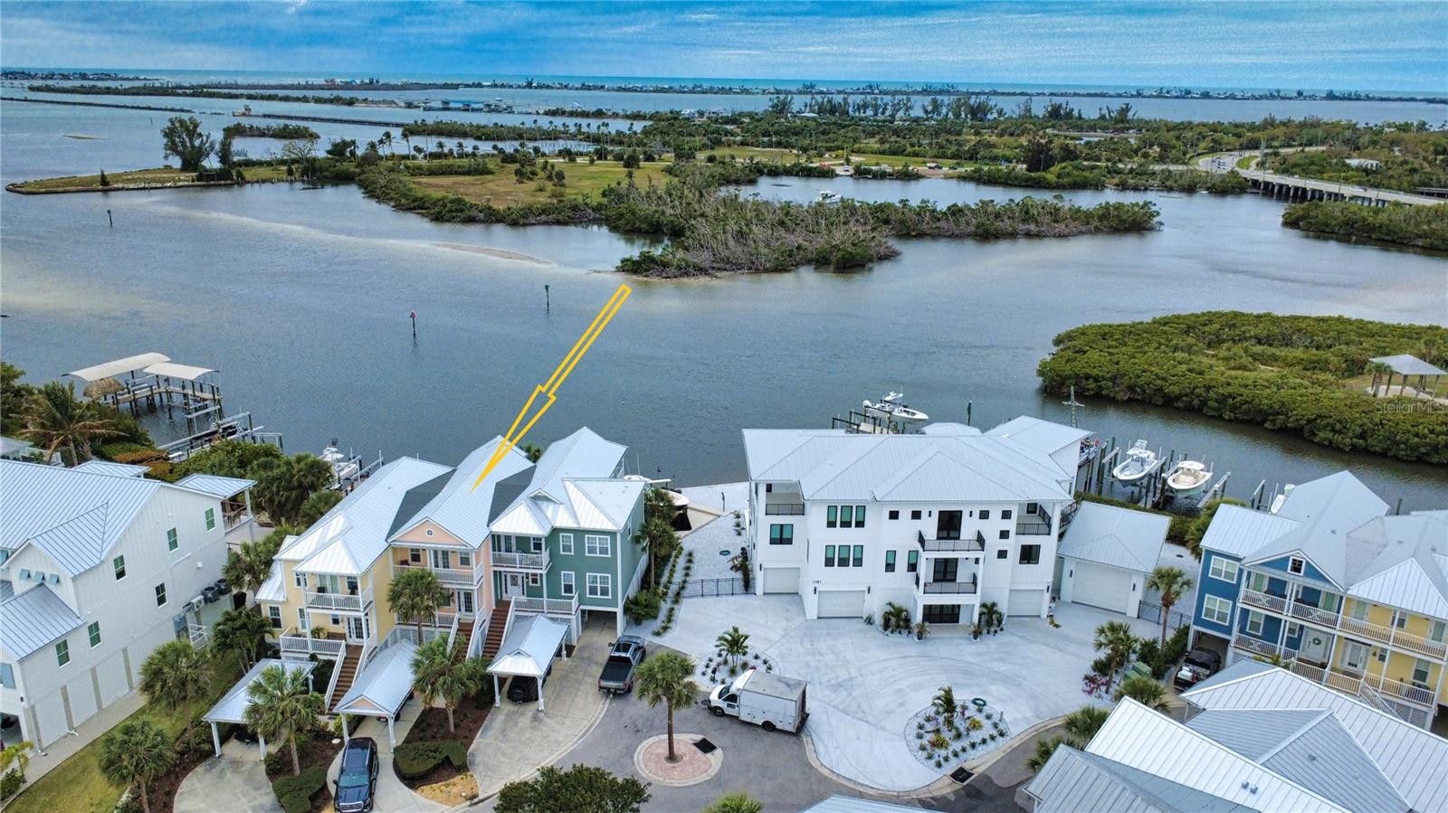 Owner Financing Available!***ONE OF A KIND townhome located in the exclusive community of Anglers Club at Boca Grande! This beautifully updated townhome offers 2 bedrooms and 2 full baths upstairs, plus a versatile den on the main level currently used as a third bedroom—perfect for guests, a home office, or flex space to fit your lifestyle. The main living area features a bright, open-concept design with a dining and family room combination, complemented by a convenient half bath. The kitchen has been upgraded with new stainless-steel appliances, creating a modern and functional space for everyday living or entertaining.

Enjoy multiple outdoor living areas with two rear balconies and an additional front-facing balcony—ideal for soaking in the Florida sunshine and coastal breezes. From your living room balcony, take in stunning water views and watch dolphins play in the Intracoastal Waterway with direct access to the Gulf—your own slice of paradise. The ground level includes a spacious storage area, providing ample room for all your beach and boating gear. Ground level also features an area perfect for entertaining! Ideally located adjacent to Gasparilla Marina, a full-service marina offering fuel, service, a ship store, and waterfront dining. Boca Grande is just a short drive, golf cart or boat ride away, known for its world-class fishing, pristine beaches, boutique shopping, and exceptional dining. Outdoor enthusiasts will also appreciate the nearby 7-mile Pioneer Trail, perfect for walking, jogging, or biking. Residents of Anglers Club enjoy access to a resort-style community pool, adding to the relaxed, resort-style atmosphere. When you're not boating enjoy being just minutes away from signature, first class golf courses, beaches, & 5-star restaurants! Whether you’re searching for a full-time residence, seasonal retreat, or investment opportunity, this waterfront townhome delivers the ultimate Florida lifestyle. Contents and personal items in storage room do not convey. FULLY FURNISHED, TURNKEY AND READY TO MOVE-IN! (Option to purchase Deeded Boat Dock separately. Ask for details)
