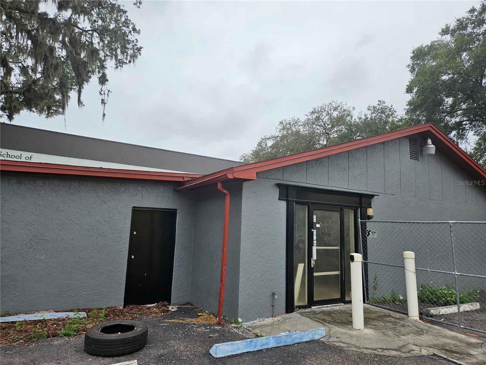 TENANT IS GONE AND CLOSING CAN TAKE PLACE.  REMODELING IS COMPLETE.  SITE HAS TWO CURB CUTS.  THREE HALF BATHS.  LEASE OPTION POSSIBLE OR EXCHANGE.  New roof to be installed soon and will be completed before closing.  The property is also available for lease.