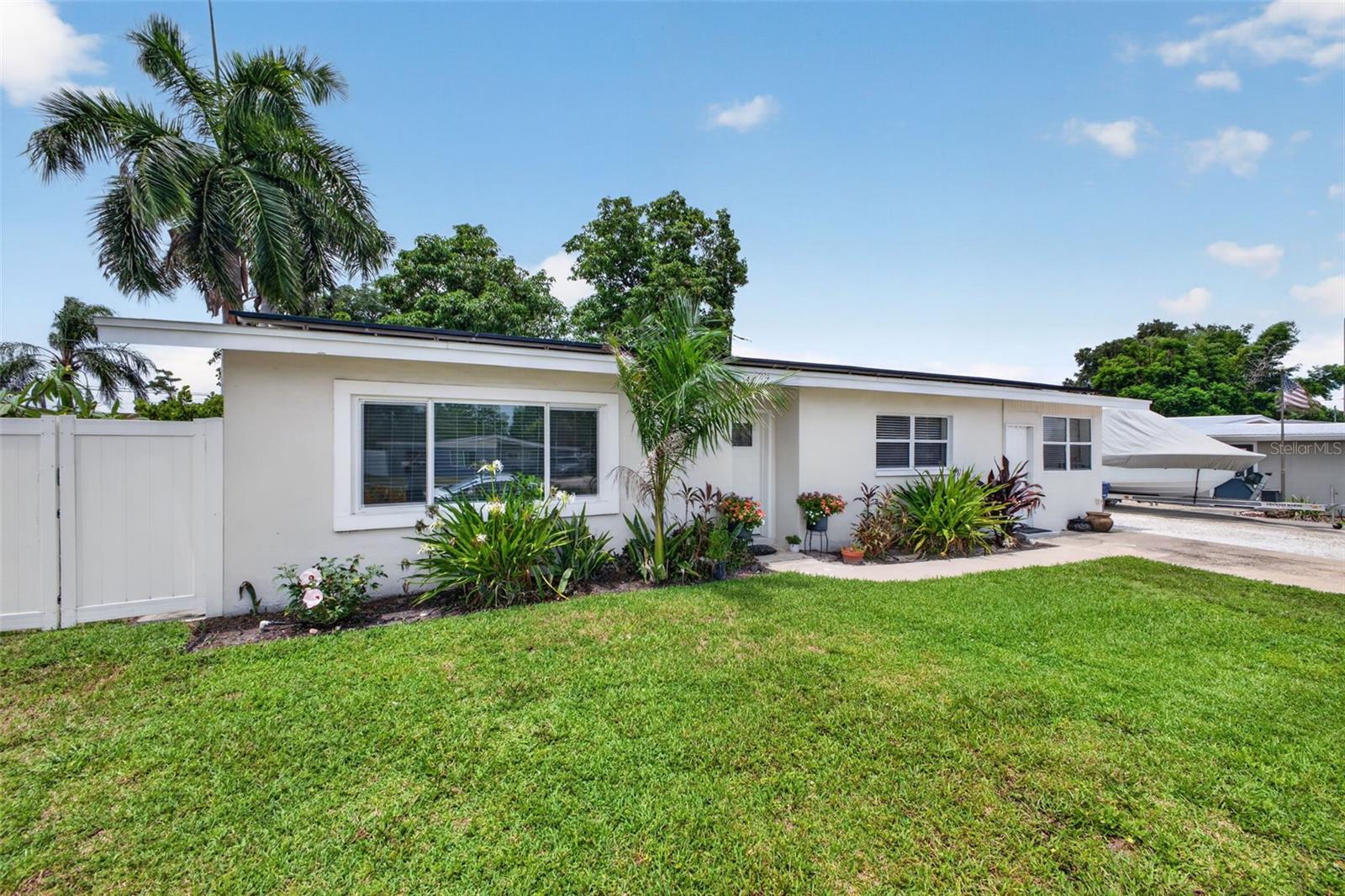 Under contract-accepting backup offers. Welcome to this charming Sarasota single family home, ideally located just minutes from vibrant downtown. Offering 2 bedrooms, 1 full bathroom and a flexible den/office/laundry space this home provides versatile living to suit your needs. The open plan living space includes a spacious eat-in kitchen and an inviting family room featuring a fireplace, perfect for a cozy night in or entertaining family and friends. The roof is 2016 and most of the house has hurricane impact windows. 
Step outside to a beautifully landscaped, fenced backyard with mature trees, including mango trees. With a covered patio, tree house and ample space, it is ideal for fun and relaxation. This property has NO HOA or CDD and an abundance of parking for an RV or a boat. 
An attached in-law suite with private entrance is currently occupied by a tenant, providing an added living space with existing rental income potential. Conveniently located near shopping, dining, parks and Sarasota's beautiful beaches, this property offers a wonderful combination of versatility, comfort and outdoor living. The property also includes solar panels with assumable financing. Don't miss out on this must see property!