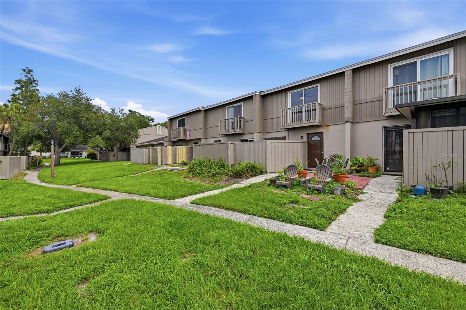 FULLY RENOVATED 2 BEDROOM, 1.5 BATH TOWNHOME-STYLE CONDO IN TEMPLE TERRACE! Move-in ready and beautifully updated, this two-story condo features luxury vinyl plank flooring throughout, fresh interior paint, updated bathrooms, renovated bedrooms, and a refreshed kitchen with brand-new stainless steel appliances. The functional layout offers spacious living and dining areas downstairs with both bedrooms privately located upstairs. Enjoy multiple private outdoor living spaces, including a covered, screened-in patio, a separate fenced courtyard, and a private balcony off the primary bedroom. Residents enjoy access to two community pools, a spa, tennis courts, and scenic walking paths surrounded by mature landscaping. The HOA covers exterior maintenance, roof, water, sewer, and trash, making for easy, low-maintenance living. Conveniently located just minutes from USF, Busch Gardens, Moffitt Cancer Center, AdventHealth Tampa, Lettuce Lake Park, shopping, dining, I-75, I-4, and Downtown Tampa. Priced at just $169,900. All financing welcome, including FHA, VA, conventional, and cash. Schedule your private showing today!