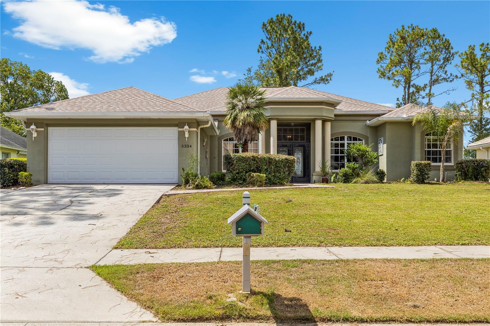 Welcome to this inviting 3-bedroom, 2-bath pool home, tucked away on a quiet street in the heart of Spring Hill. Designed with a functional layout and comfortable living spaces, this home offers the perfect blend of everyday convenience and Florida outdoor living.

Step through the elegant double-door entry with leaded glass into a welcoming foyer that opens to formal living and dining rooms accented by vaulted and tray ceilings, crown molding, and ceiling fans throughout. The home's flexible design includes a dedicated den or home office with built-in shelving, providing an ideal space for remote work, hobbies, or a quiet reading retreat.

The kitchen is thoughtfully designed with a peninsula island featuring a built-in sink, tile countertops, a coordinating tile backsplash, abundant wood cabinetry, and appliances, including a sleek refrigerator with built-in ice maker, smooth-top range and built-in microwave. A sunny breakfast nook with sliding glass doors overlooks the pool and provides seamless access to the covered lanai.

The private primary suite and two additional bedrooms offer comfortable accommodations, with carpet in the bedrooms and durable wood-look laminate flooring throughout the main living areas.

Step outside to your own backyard oasis. The screened pool enclosure features a spacious covered lanai with tile flooring and a palm-blade ceiling fan, creating the perfect setting for relaxing or entertaining year-round. Beyond the pool, mature palms and lush hedges provide privacy, while the expansive pool deck offers plenty of room for outdoor dining, lounging, and enjoying the Florida sunshine.

Conveniently located near shopping, dining, schools, medical facilities, and major commuter routes, this home combines a peaceful neighborhood setting with easy access to everything Spring Hill has to offer. Whether you're looking for your first home, a seasonal retreat, or a place to enjoy Florida living year-round, this property is ready to welcome you home.