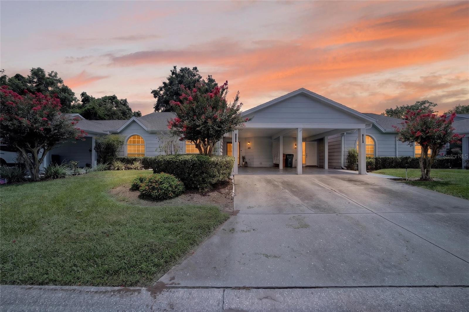 Welcome to Woodland Village — a sought-after gated community in the heart of Southeast Ocala, just minutes from downtown. Residents enjoy a resort-style lifestyle with a large community pool, tennis and pickleball courts, a clubhouse, beautiful walking paths, and more — all within the neighborhood itself.

This beautifully updated 2-bedroom, 2-bath split plan home is move-in ready and checks every box for comfortable, low-maintenance living. The heart of the home is a thoughtfully renovated kitchen featuring granite countertops, white cabinetry with glass showcase accents, extra counter space, built-in shelving, a pantry closet, and stainless appliances — all flowing naturally through a pass-through into the dining area. Luxury vinyl flooring runs throughout, neutral tones make every room feel fresh and bright, and the open floor plan connects seamlessly to the great room and an enclosed sunroom that adds a wonderful bonus living space.

The primary suite is generously sized with a well-designed bath that separates the shower and toilet from the vanity and walk-in closet — a thoughtful layout that makes everyday living easy. The dedicated laundry room includes a washer and dryer plus additional storage.

Whether you're looking for a primary residence, a seasonal retreat, or a low-maintenance investment, this one delivers. Gated community. Great amenities. Move-in ready. Come see it!
