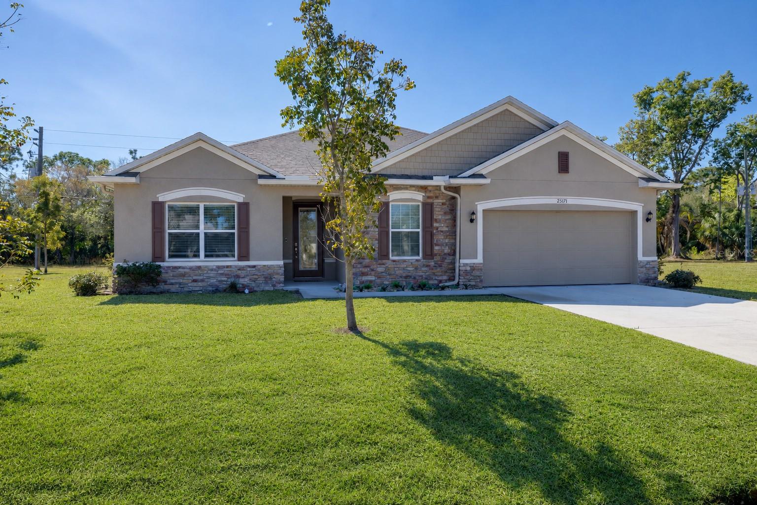 Welcome to 25171 Doredo Drive in desirable Burnt Store Village. A quiet, deed-restricted community just south of beautiful Punta Gorda in one of the area’s fastest-growing corridors. Built in 2023, this exceptional 2,046 sq. ft. like-new residence offers 3 bedrooms plus a den, 2 bathrooms, and a spacious 3-car garage layout with a 2-car garage door, offering valuable extra room for a golf cart, hobby space, or additional storage, and showcases nearly every upgrade the builder offered. Why wait to build when you can own a like-new home loaded with premium finishes, thoughtful enhancements, and modern design elements already in place? Step inside to discover an open-concept layout perfect for both everyday living and entertaining. The spacious kitchen flows seamlessly into the main living area, creating a bright and welcoming atmosphere. Generous bedroom sizes, a well-appointed primary suite, and quality craftsmanship throughout reflect the attention to detail that sets this home apart. Enjoy a private backyard with plenty of room to add a pool, creating the perfect opportunity to design your own outdoor oasis. Burnt Store Village is prized for its abundant greenspace, providing room to breathe and enjoy the Florida lifestyle. Residents are just minutes from Burnt Store Marina, where you can enjoy golf, tennis, pickleball, a fitness center, an executive golf course, waterfront restaurants, and a full-service marina for boat storage. Located just off Burnt Store Road, you’re a short drive to historic downtown Punta Gorda, Charlotte Harbor, and stunning Southwest Florida sunsets. Enjoy easy access to Punta Gorda Airport and Fort Myers, along with all the lifestyle amenities Punta Gorda is known for: boating, fishing, biking and walking trails, shopping, dining, and year-round community events. This is more than a home, it’s a lifestyle. Schedule your private showing and experience Burnt Store Village for yourself. Furniture is negotiable. Hot-tub conveys with home or can be removed. Buyer to verify room dimensions.