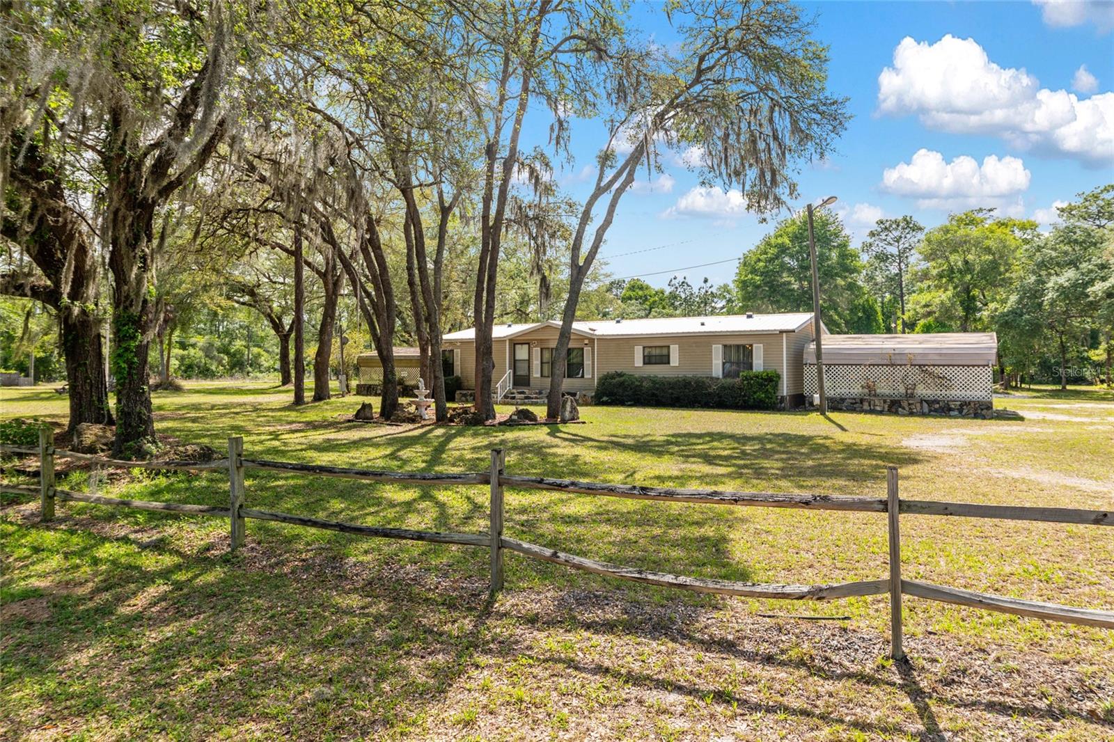 Prime 1.28-Acre Homestead Opportunity
Nestled on a peaceful 1.28-acre corner lot in an agricultural zone, this three-bedroom, two-bathroom manufactured
home offers 1,555 square feet of comfortable living space, including an enclosed porch perfect for relaxation
or extra utility. With two-way access ideal for trailers, equipment, and rural functionality, it blends serene
countryside vibes with convenient location access—tailored for investors, hobby farmers, or anyone building a
unique lifestyle.
