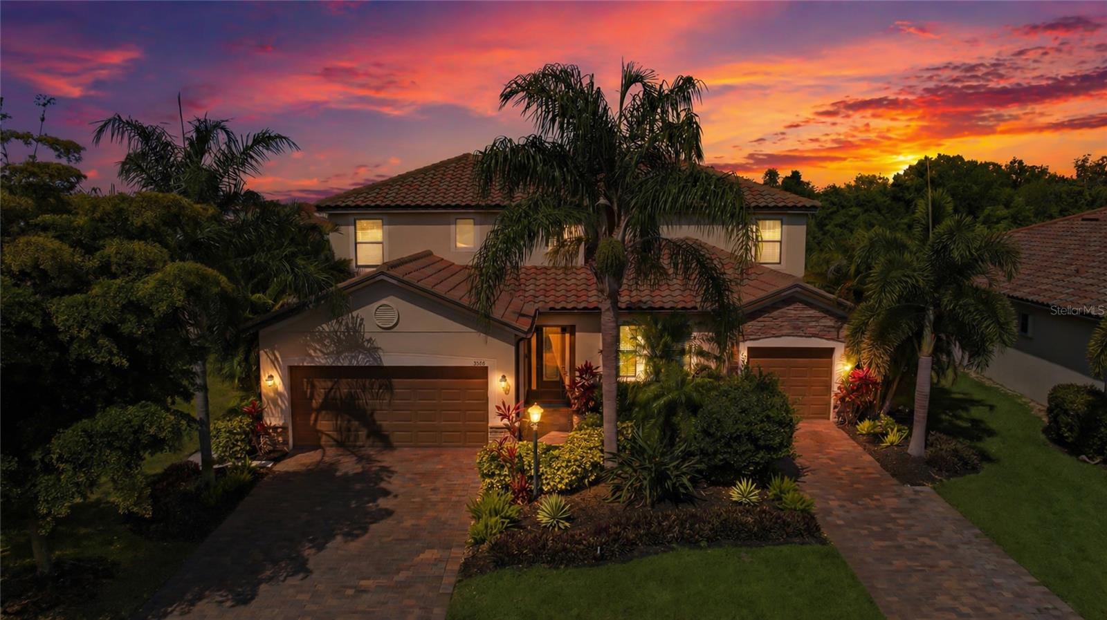 This beautifully appointed 3,900 sq. ft. Next Gen® home is perfectly situated on a premium ¼-acre waterfront lot in Lakewood Ranch—one of the nation’s top award-winning master-planned communities. The sought-after Liberation model offers exceptional flexibility, combining spacious main living with a fully private suite ideal for multigenerational living, guests, or income potential.

Designed for both everyday living and effortless entertaining, the open-concept floor plan showcases serene water views, a generous living area, and a chef’s kitchen featuring stainless steel appliances, a gas cooktop, and an oversized island that flows seamlessly into the main living space. A versatile flex room just off the kitchen can easily serve as a formal dining room, sitting area, or home office.

Step outside to your extended, enclosed lanai where a refreshing pool and spa, complete with Pentair Easy Touch System, new pump, heater, and filter, all with warranties, and LED lighting create the perfect setting to relax and enjoy the peaceful waterfront backdrop.

Upstairs, you’ll find 5 additional spacious bedrooms—including the luxurious primary suite—along with a bonus room and conveniently located laundry room, all with new carpeting. The primary suite offers an over-sized walk-in closet and a spa-inspired bath with dual vanities, a soaking tub, and a separate shower.

The private Next Gen suite features its own entrance and includes a comfortable living area, kitchenette with breakfast nook, washer and dryer, a generously sized bedroom with new carpet, walk-in closet, full bath, private lanai entrance, and a dedicated one-car garage. 

Custom built-ins, fresh interior paint, custom overhead storage systems in both garages, ceiling fans, and EverLights® permanent outdoor lighting add both style and year-round convenience to this thoughtfully upgraded home.

Located in the highly desirable gated community of Savanna at Lakewood Ranch, residents enjoy resort-style amenities including a clubhouse, fitness center, resort-style pool, playground, dog park, basketball court, and scenic walking trails.

Ideally positioned just minutes from A-rated schools, upscale dining, and premier shopping, this home also offers convenient access to the stunning Gulf Coast beaches of Anna Maria Island and Siesta Key—both renowned for their white sand and crystal-clear waters.