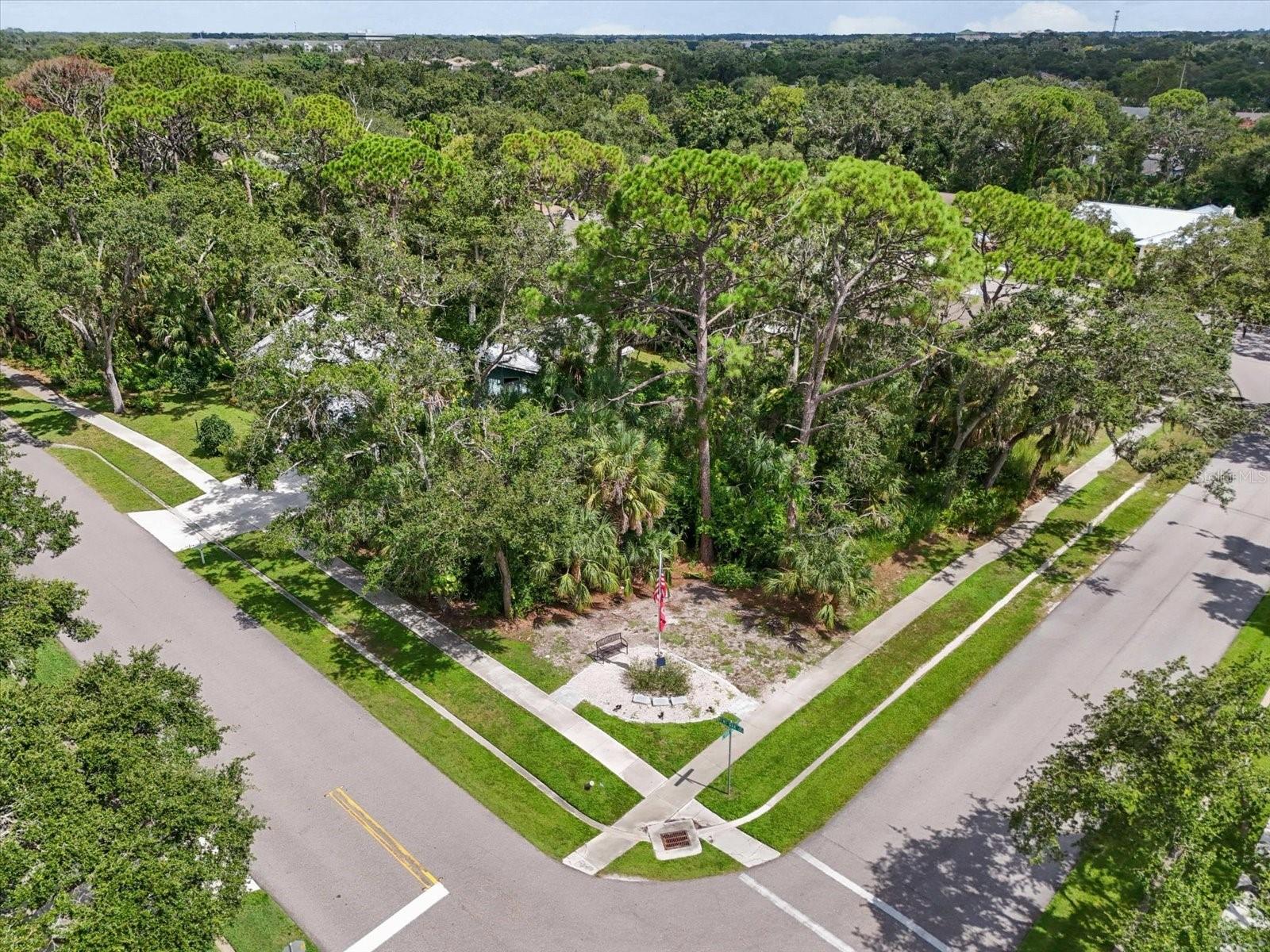 Build your dream home on this rare vacant corner lot shaded by majestic mature oak trees in a peaceful Sarasota neighborhood. This spacious corner lot offers plenty of room to create your perfect outdoor living space with privacy and natural beauty. Conveniently close to shopping, dining, I-75, and the Gulf Coast beaches, this is a prime location to build your Florida lifestyle!