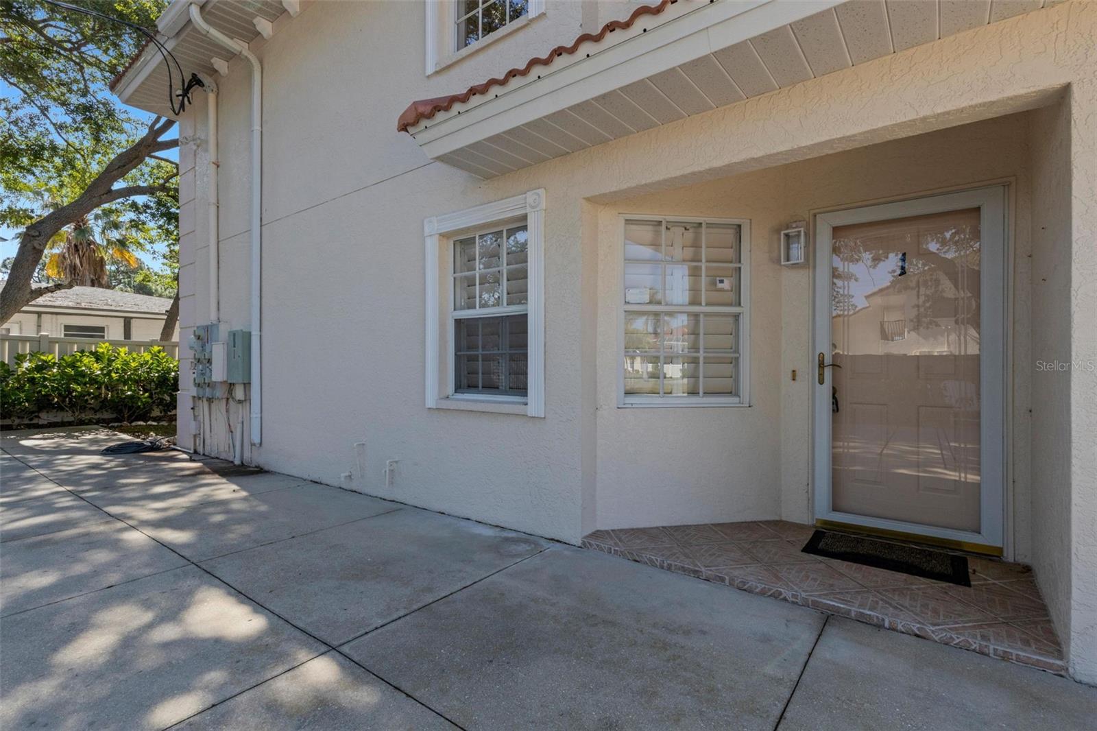 One or more photo(s) has been virtually staged. **VENICE ISLAND** This amazing unit is all about LOCATION, LOCATION, LOCATION! This intimate 4-unit complex is located across the street from the iconic Banyon Tree on West Venice Avenue.  Whether you want to stroll 2 blocks to the beach to catch some rays or sunset or even listen to the drum circle or walk 3 short blocks to town to enjoy one of the many amazing restaurants or shop at the numerous boutiques then this one's for you!  One of the largest condos on the island at 1428 sq feet!  Once you open the door to this freshly painted condo you immediately see the abundance of natural light and the open floor plan.  There is a small 5x7 office nook tucked away at the end of the living room with planation shutters.  The primary bedroom is plenty large enough for king size furniture along with large walk in closet and en-suite bath with another walk-in closet.   The guest bedroom is queen to king size and has a good-sized closet and guest bath right outside of the door.  Enjoy island living as is (just need to update the carpets) or customize to your taste - exceptional location and lifestyle.  2014 Water Heater nearing end of life, Disposal not working, ice maker not working.