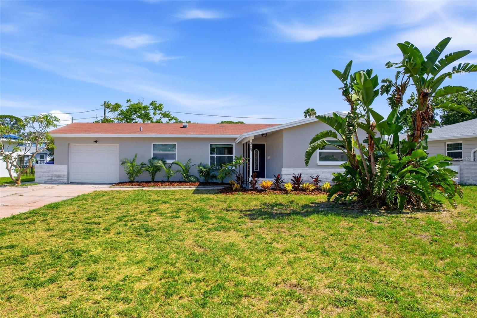 **NEW ROOF INSTALLED PRIOR TO CLOSING** Welcome to this beautifully renovated 3-bedroom, 2-bath home with a 1-car garage in the heart of St. Petersburg close to Riviera Bay! Situated on a peaceful waterfront lot with pond views, this property offers the perfect blend of modern updates and serene outdoor living. Step inside to a bright, open-concept layout featuring brand new luxury vinyl plank flooring throughout and a completely renovated kitchen with white shaker cabinetry, stunning stone countertops, stainless steel appliances, and a spacious breakfast bar overlooking the living area - perfect for entertaining. Both bathrooms have been tastefully remodeled with contemporary finishes, providing a clean and modern feel. The living space flows seamlessly to the rear of the home, where sliding glass doors lead to a screened-in patio and a fully fenced backyard with tranquil water views - an ideal setting for relaxing or enjoying Florida’s outdoor lifestyle. Additional features include updated lighting, ceiling fans throughout, many newer windows, and a functional one-car garage for storage and convenience. Located just minutes from beaches, shopping, dining, and major roadways, this move-in ready home is a rare find combining location, upgrades, and waterfront charm.