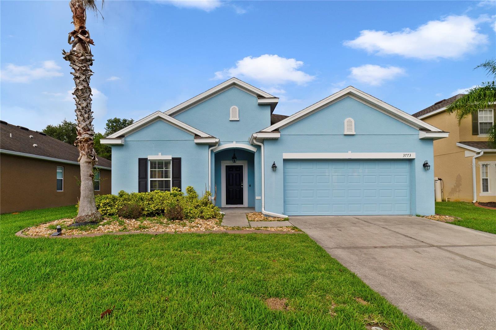 WELCOME HOME! This beautiful 4 bedroom, 2 bathroom single story homes features 1,859 square feet of living area with 2,352 total square feet under roof. This floor plan is incredibly functional with the bedrooms being spread out for privacy while the open concept living space in the middle makes entertaining and coming together easily achievable. Step inside and find the first 2 bedrooms and 1 bathroom at the front of the home. Continue down the long hallway where you will find another bedroom tucked to the side as well as the laundry room. Continue down the hall further into the open concept kitchen, family/great room, dining space with lots of windows to allow natural lighting in for an even more spacious feeling. The kitchen is adorned with stainless steel appliances and granite countertops. The primary suite is nestled into the back of the home and features an ensuite bathroom with a large shower and walk-in closet. Step out back to relish and relax on your open porch in the backyard space with no rear neighbors! Privacy is at its prime with conservation frontage! The Community Swimming Pool is within walking distance.  Conveniently located near the Florida Turnpike Exchange, get to wherever you need in the Central Florida area with ease.  East and West coast beaches are approximately an hour away ... Central Florida area attractions are less than an hour away! Call today to schedule a preview of this lovely home!