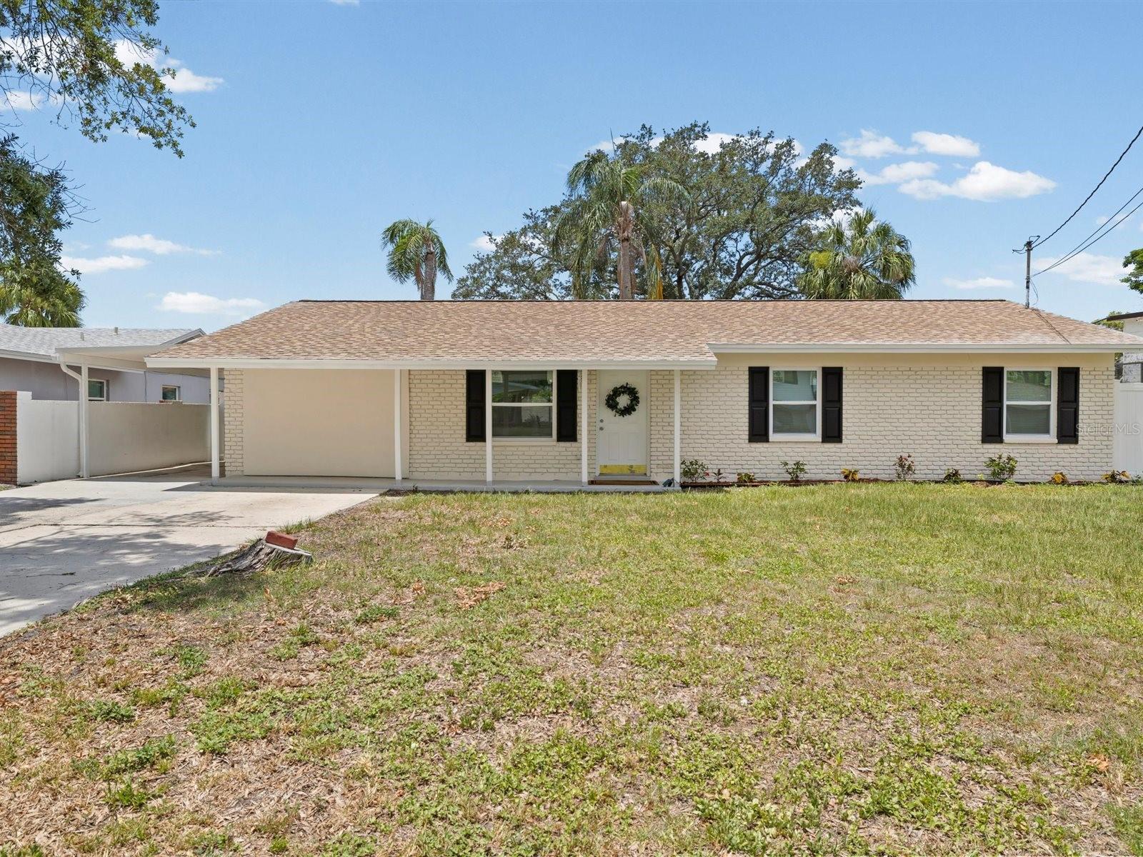 ** TOP TO BOTTOM RENOVATED HOME IN THE HIGHLY DESIRABLE BAY CREST COMMUNITY ** NO HOA ** Located in an established community offering long term value and BIG TICKET upgrades you’ll enjoy for years to come.  Better than new - this entire renovation was PERMITTED & APPROVED BY THE COUNTY WITH CURRENT BUILDING CODES - no shortcuts here!   * NEW ELECTRICAL PANEL * NEW WINDOWS * NEW PLUMBING * NEW ELEVATED HVAC * NEWER ROOF * FULLY RENOVATED KITCHEN & BATHS * NEW LVP FLOORING * FRESH NEUTRAL PAINT * NEW STAINLESS APPLIANCES * NEW LIGHTING FIXTURES * NEW WATER HEATER * INSIDE LAUNDRY CLOSET * COVERED AND SCREENED LANAI.

The OPEN CONCEPT FLOOR PLAN creates the ideal layout for special gatherings where everyone can enjoy time with family and friends. Featuring a two way split floorpan, this home offers 4 Bedroom (TWO Primary suites), 3 Baths, Living Room, Dining Room and inside laundry closet.  One of the primary suites offers a private entrance, which is perfect for an In-Law Suite or extra private Primary Suite.   The entire home boasts low maintenance, luxurious vinyl plank flooring.  The kitchen features crisp, white cabinetry, decorative ceramic backsplash, pendant lighting, stainless appliances, breakfast bar and elegant Quartz countertops.  All the baths have been beautifully renovated with modern finishes and exceptional workmanship.  Enjoy morning coffee on your huge covered lanai overlooking a fully fenced yard.  Plenty of room for a pool and situated perfectly for privacy.

Residents of Bay Crest Park enjoy no HOA fees or deed restrictions, along with access to a private neighborhood boat ramp. Highly rated school district too!  Zoned for Alonso High School which offers the prestigious International Baccalaureate (IB) Diploma Program. This community is truly a Tampa GEM which offers a prime location, top rated schools and a superb location - 2 miles from Berkeley Prep - 8 min from Tampa International Airport - 20 min from Downtown Tampa and 35 min from Clearwater Beach.  Turn-key and move-in ready, this property presents a rare opportunity for buyers seeking quality craftsmanship, modern upgrades, and long-term value in a prime Tampa location.