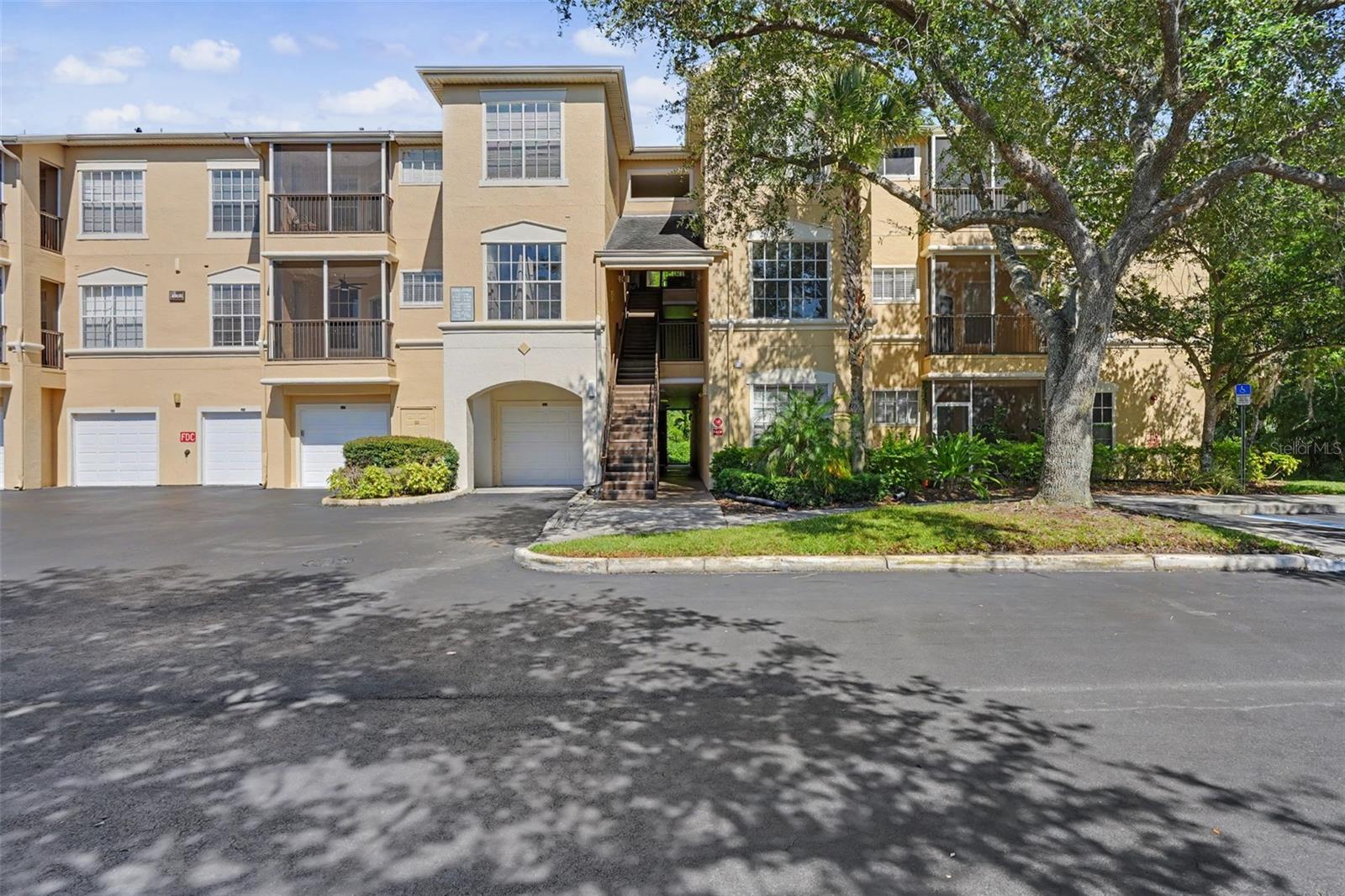 Experience resort-style living in this beautifully renovated 2-bedroom, 2-bathroom condo located in the gated community of Oxford Place at Tampa Palms. Featuring a desirable split and open floor plan, this move-in ready residence underwent a complete renovation in 2025, including fresh interior paint, a full kitchen remodel, both bathrooms updated, new luxury vinyl flooring throughout, modern plumbing fixtures, and a 2025 water heater. The stunning kitchen is designed to impress with Calacatta quartz countertops, stainless steel appliances, ample cabinetry, and a functional layout that opens seamlessly to the main living space. The spacious primary suite offers a private retreat with a beautifully remodeled bathroom, while the split-bedroom layout provides privacy for guests or family members. An in-unit laundry area includes a 2026 washer and dryer for added convenience. Step outside to the shaded patio, the perfect spot to enjoy your morning coffee or unwind after a long day. Residents of Oxford Place enjoy an array of amenities, including a resort-style pool, clubhouse, fitness center, playground, and more, all within a secure gated setting. Conveniently located just off I-75, this home offers easy access to shopping, dining, and entertainment, while being only 10 minutes from USF and Busch Gardens. Whether you're looking for a primary residence, seasonal getaway, or investment opportunity, this updated condo offers comfort, style, and an unbeatable Tampa location.