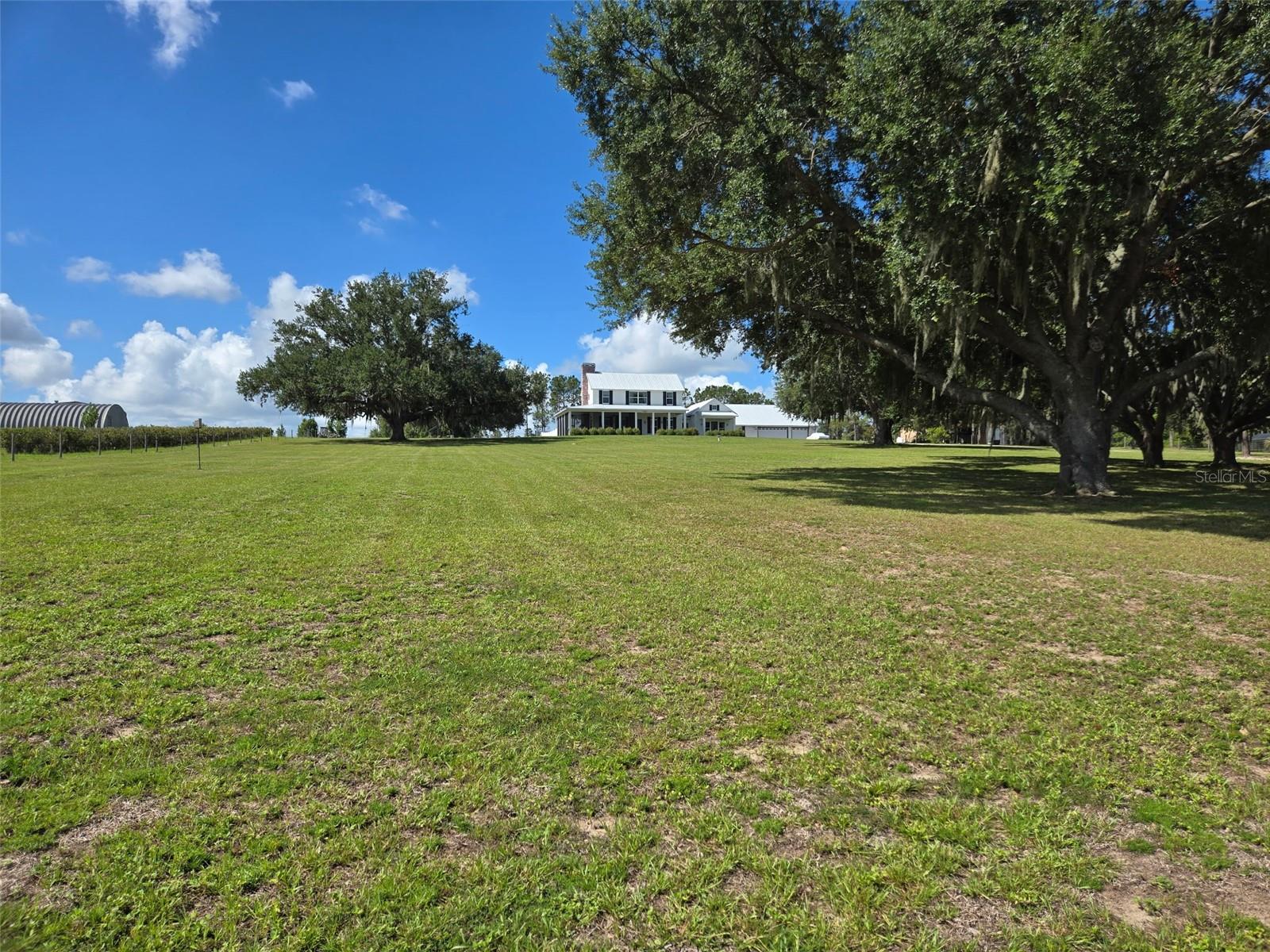 An unbelievable opportunity has become available in the quaint town of Clermont! If strolling or fitness is your hobby, this town has it all. A special place taking you back in time, while walking, running, and biking are available on the Clermont/West Orange Trail that goes right through the town. This special town is sprinkled with restaurants, merchandise boutiques, amazing lakefront dining and plenty of bakeries and ice cream stores to cure that sweet tooth. A local brewery is coming to town with special events while the mayor makes sure every holiday is celebrated, whether it’s decorated, has holiday music or fireworks!  While the town is nestled around the Clermont chain of lakes, you have easy access to major expressways and Themed Parks. This is Florida that meets new Florida for sure!!
Now get ready to visit your newer lakefront home 7956 Lake Nellie Road! A true country feel, as you travel to your little bit of paradise just waiting for your imagination.  With almost 5 acres of land, you can fulfill your dream of raising chickens or bringing your horse while still water skiing on your private Lake Nellie. Your dock is ready to add your floating docks to place your water toys!
As you drive to your impressive estate, expect to be impressed as your land sprawls over both sides of the road. As you pull in your long driveway, get ready for the magic of carefree living in your gently used 2019 custom home. Enjoy the breathtaking views as you stroll towards the front door and take note of your screened in front porch that possibly could become one of the many favorite features of the home.
March through the door and explore the breathtaking great room with beautiful wood floors. This amazing space includes a fireplace and windows to give you views of your entire property. The wraparound porches are breathtaking, while this space allows you to be creative in setting it up for your lifestyle. The room flows into your gourmet kitchen with an amazing, oversized island perfect for preparation and social events. A commercial Gas cooktop with separate double ovens will make your chef in the family extremely happy. The oversized pantry and utility area can double as an additional food prep area and kitchen planning center. You have a great view of the backyard from your kitchen to watch the family. As you stroll outside through the mudroom to join them, have comfort knowing it is fully fenced.
When you are ready to retire for the evening, your guests can stroll to their detached space with a private entry from the back. For you, pass through the great room to a parlor to catch up on some reading before retiring to the bedroom with a private lakeview patio. An impressive walk-in closet and resort style spa bathroom awaits with a soaking tub, double sinks, walk-in shower and private commode to complete the primary. The rest of the family can head upstairs to a bonus room perfect for gaming before heading to the two junior suites with walk-ins and private bathrooms.
 
There are too many upgrades to mention but, the entire home is encapsulated with foam insulation, Hardie plank siding, a 12KW Emergency generator and have an oversized 3 car garage for the toys and a workshop

This home has it all, so make your private appointment today while the opportunity still exists.