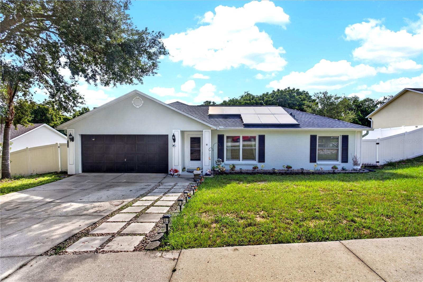 MOVE-IN READY POOL HOME! Beautiful 3-BEDROOM, 2-BATH home with a 2-CAR GARAGE THAT HAS BEEN CONVERTED INTO A GUEST BEDROOM, offering additional living space and the flexibility to easily convert it back into a full garage if desired. This well-maintained home features an OPEN FLOOR PLAN with a spacious kitchen overlooking the family room and dining area, making it perfect for everyday living and entertaining. Elegant light fixtures and tasteful finishes throughout add warmth and style to every room. The spacious PRIMARY SUITE offers a WALK-IN CLOSET and a WALK-IN SHOWER, creating a comfortable private retreat. Step outside to your 12' x 9' COVERED & SCREENED LANAI, the perfect place to enjoy your morning coffee or unwind in the evening while overlooking the FULLY FENCED BACKYARD. Cool off in your PRIVATE POOL, entertain family and friends, or take advantage of the convenient STORAGE SHED for your outdoor equipment and extra belongings. Major updates include a NEW A/C (2025), NEW ROOF (2020), NEW WATER HEATER (2020), and NEW MICROWAVE (2025), providing peace of mind for years to come. The home also features SOLAR PANELS to help reduce monthly electric costs, along with a VERY LOW HOA and NO CDD. Ideally located with quick access to the Florida Turnpike, Highway 50, and US-27, this home is just minutes from Walt Disney World, Orlando attractions, Orlando International Airport, Downtown Clermont, and Winter Garden. Enjoy nearby shopping, Costco, Publix, Target, Home Depot, restaurants, golf courses, parks, walking and biking trails, South Lake Hospital, AdventHealth Minneola, VA medical facilities, Lake-Sumter State College, and TOP-RATED SCHOOLS, including Minneola Charter School. DON'T MISS THIS INCREDIBLE OPPORTUNITY TO OWN A BEAUTIFULLY MAINTAINED POOL HOME IN ONE OF CENTRAL FLORIDA'S MOST CONVENIENT LOCATIONS—SCHEDULE YOUR PRIVATE SHOWING TODAY!