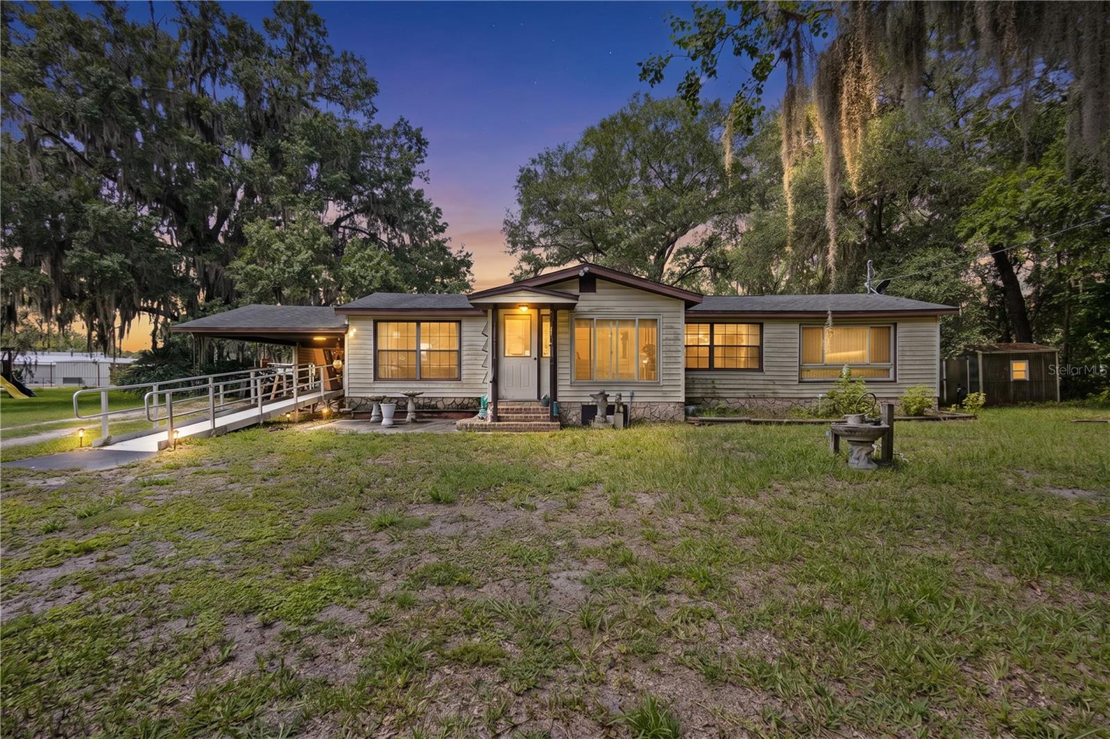 Virtually Staged. Market Road Revival: A 1959 Jim Walter home on approximately one acre, ready for its next chapter in the heart of Starke.

Motivated seller, investor opportunity in Starke! This 1959 Jim Walter home sits on approximately one acre in a convenient in-town location near downtown Starke, local schools, shopping, dining, medical services, and major travel routes including US-301. The location gives this property strong practical appeal for a future homeowner, tenant, or long-term hold strategy, with easy access to the everyday conveniences of town while still offering a larger lot and more breathing room than many typical in-town properties.

The home offers a flexible layout with prior additions and renovations completed over time, giving the next owner a solid starting point for its next chapter. Interior features include an expanded main suite, enclosed porch/sunroom, updated kitchen area, remodeled bath spaces, central heating and cooling, city water and sewer, vinyl siding, and insulated windows in many areas. The existing footprint provides useful living space and several options for how the home could be refreshed, reworked, or improved depending on the buyer’s goals.

This property is ready for someone with vision to give it the care and attention it deserves. The roof is older and should be factored into the buyer’s plans, but the overall opportunity is clear: location, lot size, utility access, and usable living space all in one package. For the right buyer, this could be a strong candidate for a fix-and-flip, rental, or long-term value-add hold.

Whether you are looking to renovate and resell, improve and rent, or create a more affordable primary residence with upside, this property gives you room to work with. Sold as-is. Seller is motivated. Bring your contractor, walk the property, run the numbers, and see what this home could become. Buyer to verify all property details, measurements, condition, permitting, zoning, financing eligibility, and intended use.