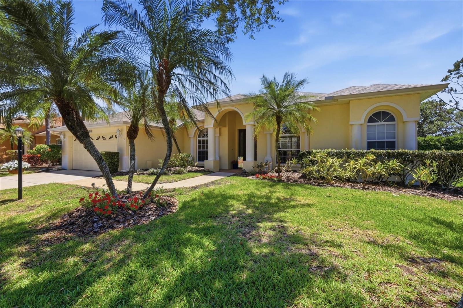 Tucked away on a quiet street in the highly sought-after Riverwalk Hammock community of Lakewood Ranch, this exceptional residence offers a rare blend of privacy, comfort, and effortless Florida living, all with very low HOA fees. Thoughtfully designed with soaring ceilings, generously proportioned living spaces, and an open-concept layout, the home feels bright, inviting, and remarkably spacious. Expansive windows and sliding glass doors bathe the interiors in natural light while creating a seamless connection to the outdoors. Beyond the welcoming foyer, the formal living and dining areas set the tone for elegant entertaining and everyday ease. An adjacent sitting area provides additional gathering space and can also function beautifully as a home office, reading room, or flexible-use space. The well-appointed kitchen features rich wood cabinetry, granite countertops, two pantries, and bar seating, flowing naturally into the comfortable family room. Designed to embrace indoor-outdoor living, the private screened lanai is accessible from the living room, family room, primary suite, and in-law suite. With both covered and open-air seating areas, along with a sparkling hot tub, this outdoor retreat offers plenty of room to relax, entertain, and unwind in complete privacy. The spacious primary suite is a peaceful escape, featuring a cozy sitting area, walk-in closet, and large ensuite bath with a private water closet. On the opposite side of the home, a generously sized guest bedroom, well-appointed bath, and dedicated library or office provides excellent separation and flexibility. The office could easily be converted into a fourth bedroom with the addition of a closet. A spacious laundry room, two-car garage, and roof replaced in 2021 complete the home. Located in the heart of Lakewood Ranch, this residence places you just minutes from Lakewood Ranch Main Street, Waterside Place, University Town Center, scenic walking and biking trails, world-class golf courses, top-rated schools, dog parks, dining, shopping, and more. Experience the best of Florida living in a beautifully designed home in one of Lakewood Ranch’s most desirable locations.