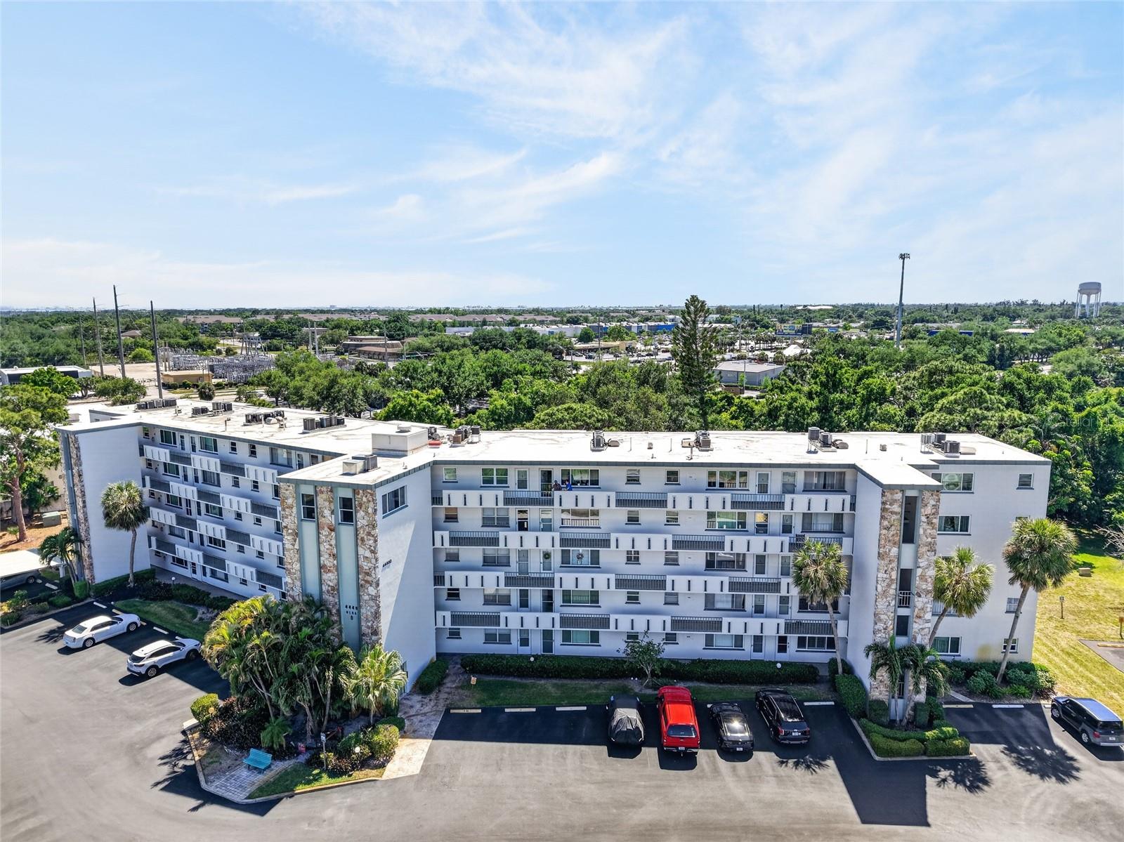 Step directly into resort-style living at Ironwood Condos. This premier 55+ community overlooks a walkable 18-hole public course, lighted tennis, and brand-new pickleball courts right outside your door. Imagine ending a day on the links by heading up to your fifth-floor private balcony where the greenbelt goes quiet and the trees hold the last of the light. Paired with a massive, newly renovated recreation complex and a sparkling heated resort pool, this neighborhood offers maintenance-free, look-and-leave living designed for maximum freedom and an active lifestyle.
This turnkey fifth-floor condo is fully furnished and move-in ready!
Inside, the kitchen has been updated with white cabinetry, granite countertops, a subway tile backsplash, and stainless steel appliances. Vinyl plank flooring runs through the entire unit, and the open living and dining area anchors around a stone accent wall. The primary bedroom is well-sized with a built-in closet and private en suite bath.
The community's active lifestyle options are genuinely extensive: tennis courts, pickleball, a fitness room, sauna, BBQ facility, a Golf Pro Shop, clubhouse, miles of walking trails connecting Ironwood and Pinebrook, and a new pool and recreation center. Monthly fees cover cable, internet, water, sewer, trash, and pest control. One check, and the upkeep is handled. The building has a newer elevator, updated plumbing stacks, and sits in Flood Zone X. A same-floor laundry room and a dedicated storage unit are included.
Bradenton's Gulf beaches and Anna Maria Island are less than seven miles out. The Sarasota-Bradenton International Airport, GT Bray Park, and a full range of shopping, dining, and medical services are close by. One small pet welcome.