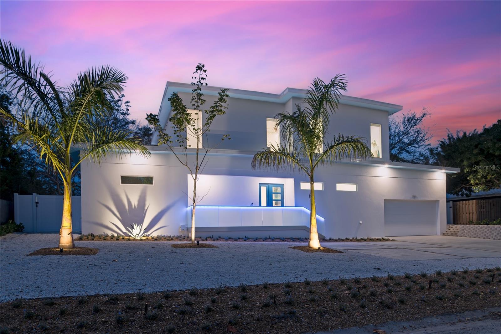 Step into modern luxury at The Palace on Clematis, a nearly-new 2024 single-family home offering more than 3,500 square feet of impeccably designed living space where every detail has been curated for refined living, from its modern architecture to its resort-style amenities. This six-bedroom, seven-bath residence combines high-end finishes with relaxed Florida style, delivering an exceptional opportunity for discerning buyers. The open floor plan features expansive living and dining areas that flow seamlessly together, centered around a chef’s kitchen boasting premium appliances, a large center bar top island, and custom cabinetry with under-cabinet lighting. Two bedrooms are conveniently located on the first level, including the spacious primary suite with it's spa-inspired ensuite bath designed for total relaxation. Head out any of the sliding doors to your private outdoor retreat, where a heated pool & spa, firepit lounge, and lush tropical landscaping create the perfect oasis for entertaining or unwinding. Upstairs, you'll find four more ensuite bedrooms, each with its own walk-in closet and distinctive designer details, along with an informal family room and extended balcony that offer another inviting gathering space. Situated in the sought-after Arlington Park and South Gate area, this residence provides proximity to top-rated schools, cultural attractions, boutique shopping, and Sarasota’s best dining destinations. The central location also offers quick access to world-class beaches, medical centers, and regional airports. A true showcase of craftsmanship and contemporary elegance, The Palace on Clematis is a rare find in central Sarasota. Discover this one-of-a-kind residence and make it your new Sarasota address. A 1% RATE BUY-DOWN IS AVAILABLE TO QUALIFIED BUYERS WHO WORK WITH THE SELLER'S PREFERRED LENDER.