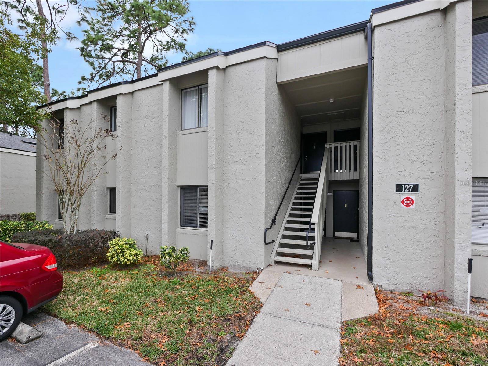 One or more photo(s) has been virtually staged. Discover the perfect downstairs one bedroom, one bath condo conveniently located in Longwood, Florida. Just a short stroll from your favorite dining spots like Starbucks, Bonefish Grill, Pickles Authentic, Chianti's Pizza and near Longwood Farmers Market and quick access to Altamonte Mall, Uptown Altamonte, hospital, beaches, attractions and I-4. This charming condo with new AC 5/25 & a new electric panel 10/25, new water heater 11/25 & offers a spacious living room, dining area, kitchen with refrigerator, dishwasher, range, a back splash & pantry. The large master bedroom has a large walk-in closet. The building sits on the east side of the complex, has a newer roof and there’s lots of parking for guest. Association dues pay for water, sewer, garbage, security, along with exterior maintenance of the building and grounds all for only $370 per month. The condominium has night-time security on premises, you can have peace of mind while enjoying the amenities, including two sparkling pools, tennis and basketball courts, a fitness room, a clubhouse, on-site laundry, and a car wash station with vacuum. Springwood Village offers sturdy all block and stucco construction. Property may be under video/audio surveillance.