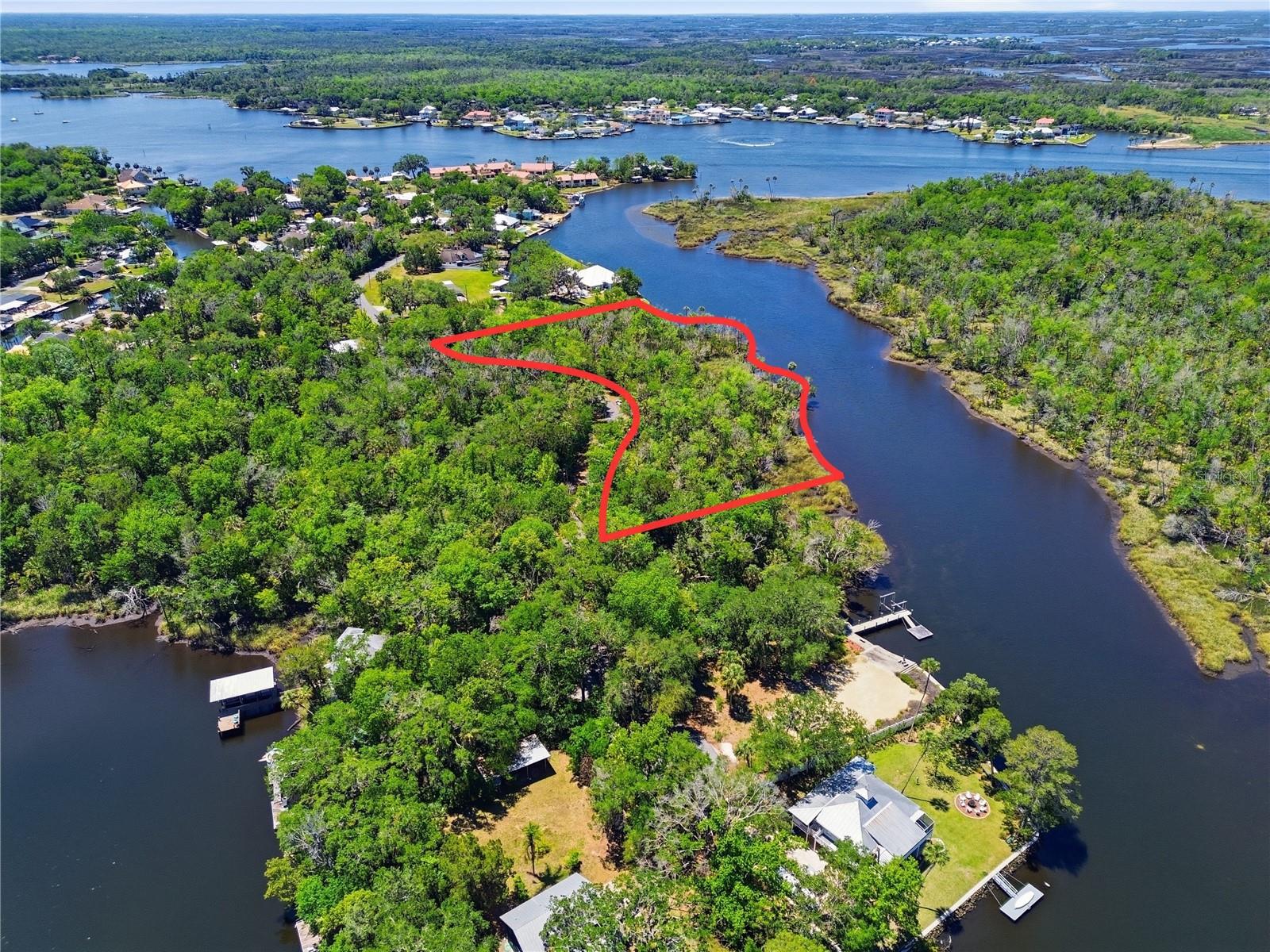 Recently under contract shortly after hitting the market. Back on market due to buyer’s personal circumstances, no fault of seller or property. 3.11-acre waterfront development opportunity within Crystal River city limits, one of Florida's most sought-after Nature Coast destinations and the only place in the United States where you can legally swim with manatees. This parcel sits with direct creek frontage feeding into Kings Bay and the Gulf of Mexico, minutes from world-famous Three Sisters Springs by boat. [Public utilities connection is available, no well or septic required. Municipal water and sewer available through Crystal River Utilities District, Duke Energy electric is the areas electric provider, and the lot sits on a paved county-maintained road]. Per the city of Crystal River, this parcel can be subdivided. The parcel supports multiple single-family lots, each with the potential for private dock access on Miller Creek. Elevated construction required per Flood Zone CAZ designation, standard for the Crystal River waterfront market and fully priced into buyer expectations. If you're seeking the Nature Coast lifestyle; manatee tours, scalloping season, world-class fishing, spring diving, and a charming downtown dining scene then this lot may be for you. Publix, Rural King, Target, and Walmart are all within 10 minutes south on US-19. Drive by and take a look!