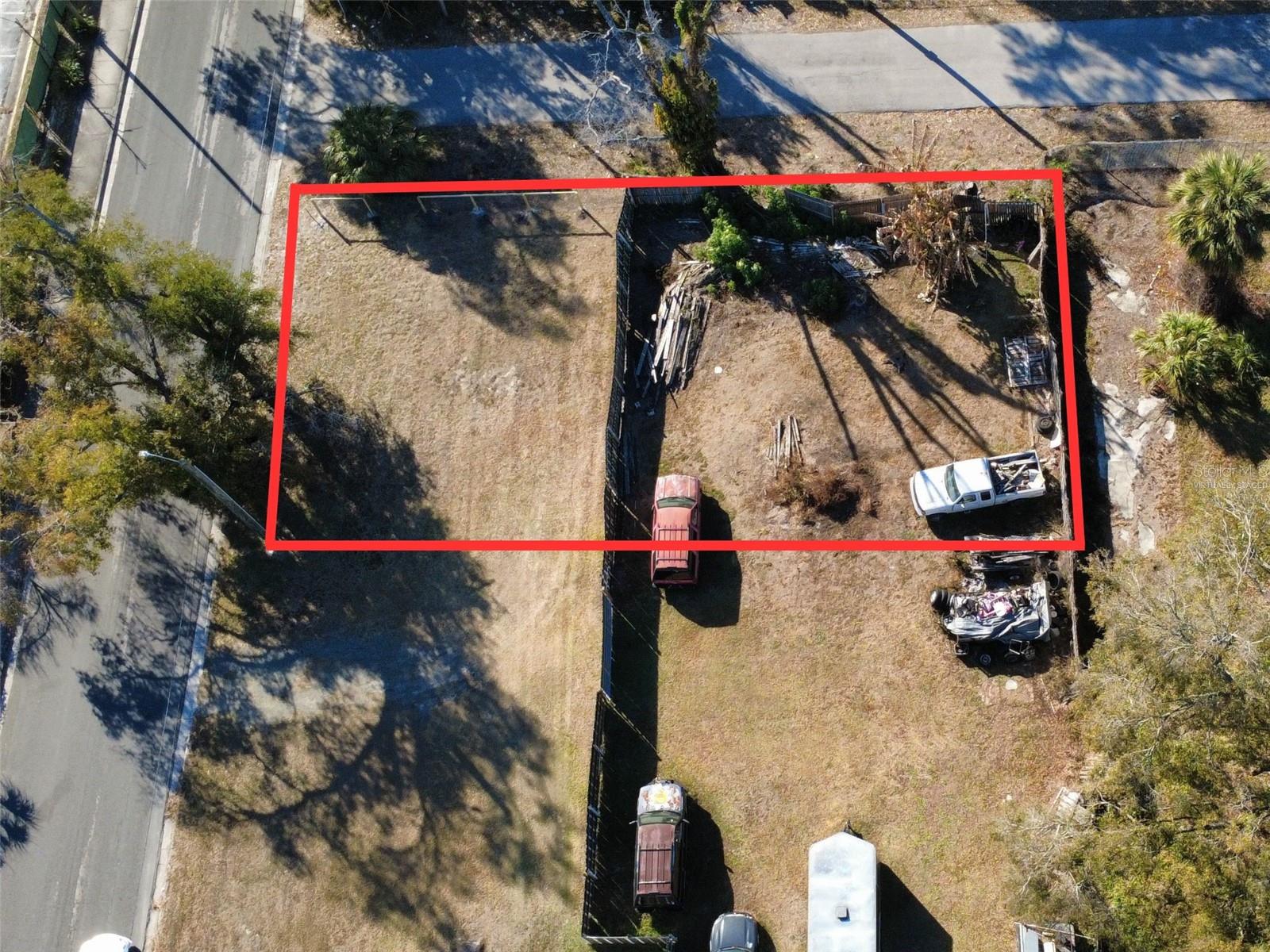 One or more photo(s) has been virtually staged. Red outline shows approximate lot boundaries. Existing fence does not represent actual property lines.

**DUPLEX APPROVED**The City of Tampa allows a duplex to be built on this property, creating the opportunity for two streams of rental income. Great opportunity for investors, builders, and developers seeking a single-family or multifamily development parcel. This 54x108 corner lot is zoned RM-16 and is centrally located near Interstate 4 with quick access to Downtown Tampa, Ybor City, and major surrounding areas. Convenient commute to Lakeland and Orlando.