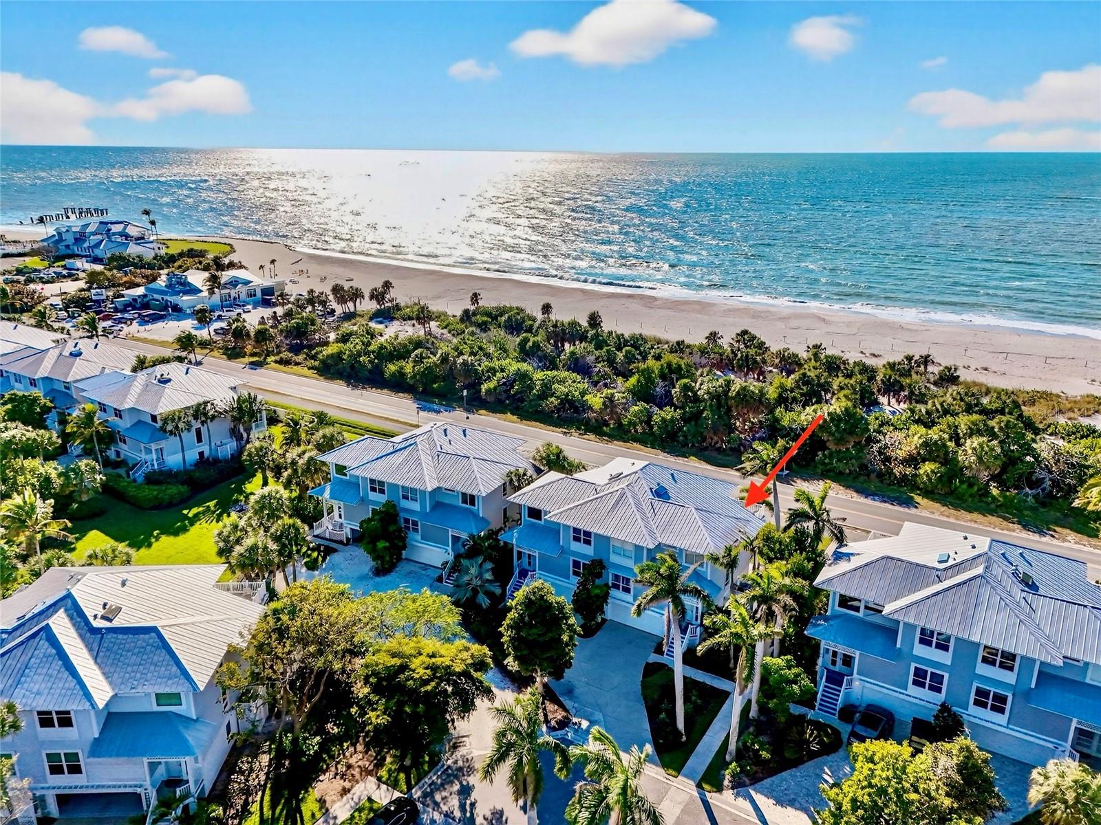 Located along one of Boca Bay’s most desirable front-row settings, 760 Beach View Drive presents a rare opportunity to own a Kentia townhome with direct Gulf views and an outdoor feature found at only 2 townhomes in the community—a private, fenced and walled backyard, ideal for dog owners or those seeking secure outdoor space.

Thoughtfully positioned adjacent to a picturesque royal palm-lined sidewalk, the residence enjoys a sense of arrival and openness while maintaining privacy. Inside, warm wood flooring throughout the main living room and stairways sets a welcoming coastal tone. The enclosed main-floor lanai expands the living space, offering a versatile area for relaxing, dining, or entertaining while remaining protected from the elements.

The kitchen has been tastefully refreshed with quartz countertops and stainless-steel appliances, blending modern functionality with timeless appeal. A fully updated main-floor bathroom adds both convenience and style for guests and daily living. Storm protection is well addressed with a combination of impact-rated glass and electric roll-down shutters, providing peace of mind without compromising light or views.

One of the home’s most compelling features awaits above: a top-floor sundeck with composite decking and railings, perfectly positioned to capture Gulf views, coastal breezes, and unforgettable sunsets. Additional exterior improvements include a 5V-crimp metal roof installed in 2019, ensuring durability and long-term value.

At ground level, the residence offers a three-car garage with an additional storage room, ideal for vehicles, golf carts, beach gear, and owner storage, an increasingly valuable amenity on Boca Grande.

Just steps from the beach and moments from Boca Bay’s full suite of resort-style amenities including the Pass Club, Beach Club, fitness facilities, dining, tennis, pickleball, pools, boat dockage, and private fishing pier.  760 Beach View Drive combines location, views, upgrades, and a truly rare outdoor offering into one exceptional coastal lifestyle opportunity.