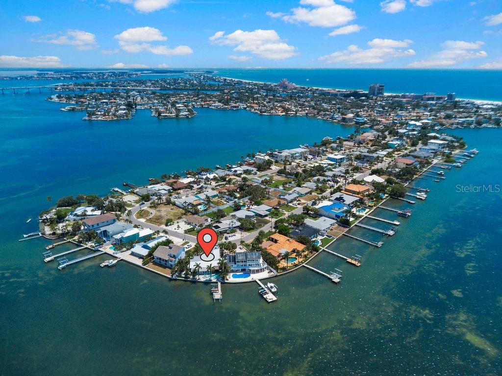 Experience the best of waterfront living in this beautifully updated 4-bedroom, 2-bath home at the quiet end of desirable Boca Ciega Isle. Boasting 96 feet of Intracoastal waterfront, this exceptional property captures breathtaking open-water views, unforgettable sunsets, and the relaxed coastal lifestyle St. Pete Beach is known for.

The bright, open floor plan is designed for effortless entertaining, seamlessly connecting spacious living areas to an incredible waterfront outdoor retreat featuring a covered grilling area, private hot tub, outdoor shower, and multiple spaces to relax or gather with family and friends. A bonus room overlooking the water provides the perfect setting for a home office, media room, or peaceful retreat with spectacular views.

Spend your days on the water with the convenience of both a boat lift and jet ski lift, then return home just minutes from the award-winning beaches, local restaurants, and vibrant island attractions. An oversized 2-car garage along with additional storage sheds provide plenty of room for vehicles, beach gear, and water toys.

Whether you’re enjoying your morning coffee by the water, entertaining at sunset, or heading out for a day on the boat, this exceptional waterfront home offers the Florida lifestyle at its finest.