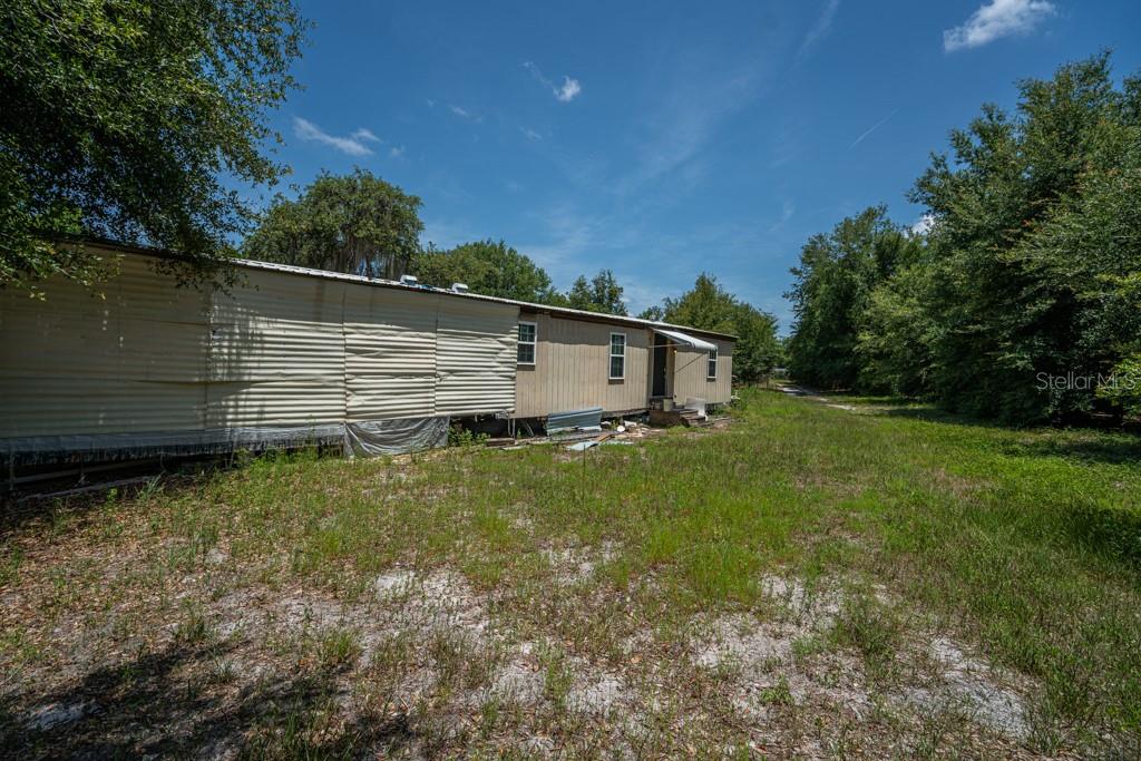 Are you looking for privacy or are you a nature enthusiast? This property is for you! The owner would like to sell all 3 of these fabulous properties as one. This includes a 5 acre parcel that fronts on Wilson Parrish Road that has a single wide on it that needs work. This home is a 2 bedroom/1 bath manufactured home. The other two properties consist of 47 acres on Yale Road and another 39 acres on the corner of CR 450 West and Lake Yale Road. This 39 acres has a 4 bedroom/2 bath manufactured home on it. Downtown Umatilla is a short 3 miles away. This area of North Lake County is still reminiscent of old Florida, a place you will want to call home for a lifetime. Schedule your private tour today!
