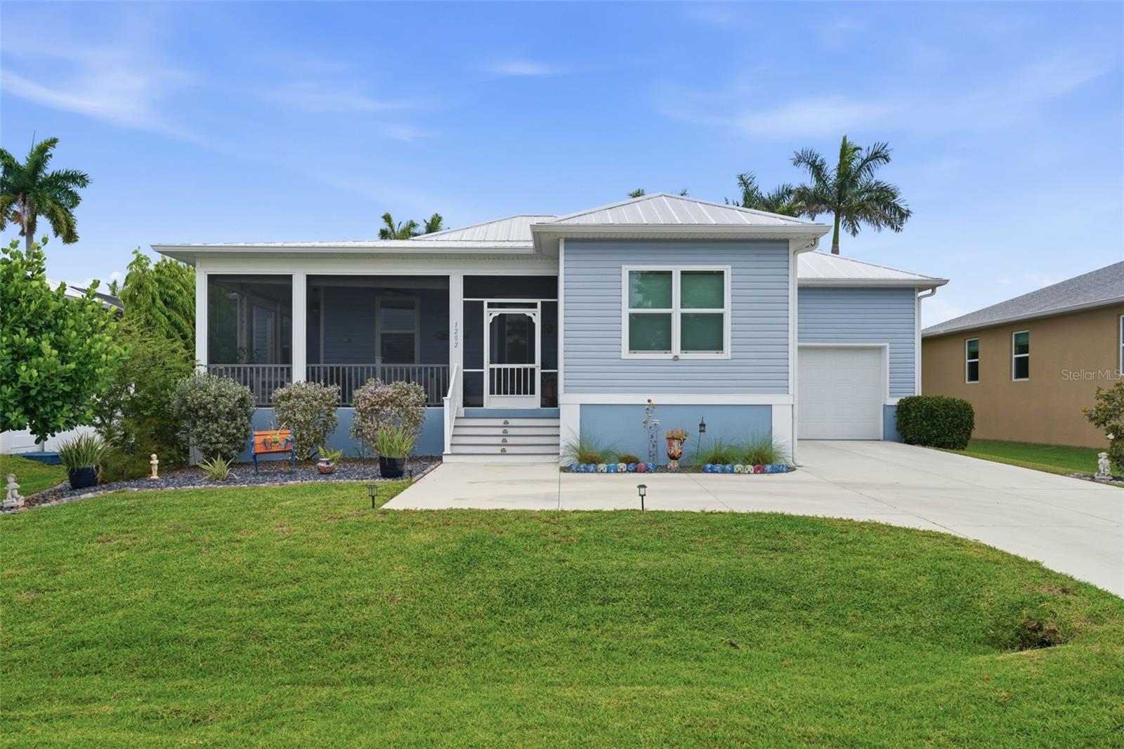 Charming home nestled in the Historic District of Punta Gorda. Just a short stroll or bike ride takes you to downtown or Fisherman's Village, where you will discover great local restaurants, boutiques, vibrant farmers markets, and the scenic waterfront at Gilchrist Park. Here you can enjoy pickleball, basketball, tennis, fishing, playgrounds, and sunset walks along the harbor front walk path. This home was custom built five years ago featuring many upgrades. Inside, there is a Premier Water Purification filtration system throughout the home and the floors are covered with waterproof scratch-free laminate.  Abundant windows help fill the space with natural light, enhancing the bright, airy feel in every room. The kitchen is both functional and inviting, featuring stone quarts tops and complimentary mirror backsplash, newer Bausch appliances, and a window overlooking the fenced in private backyard that provides a private retreat with plenty of room to relax or entertain  The dining room as a hurricane window door exits to this cozy courtyard setting with a 20 x 12 awning with an automatic-closing feature when winds increase too much. The primary suite bathroom has double sinks, shower and walk in closet.  Whether you’re searching for a primary residence, vacation getaway, or investment opportunity, this property places you in the center of one of Florida’s most charming coastal towns. Historic surroundings, tree-lined streets, and close proximity to marinas, boating, and the harbor lifestyle make this a rare chance to own in the downtown Punta Gorda area. Too many additional features to list. MUST SEE THIS HOME!!