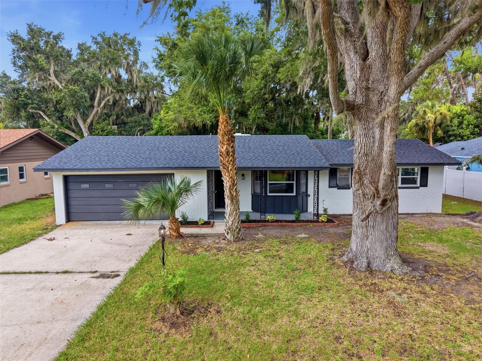 Under contract-accepting backup offers. ***Multiple offers received, highest and best by Thursday, 6/25, at 4pm*** Completely renovated and move-in ready! This beautifully updated 3-bedroom, 2-bath home sits on a spacious 0.26-acre lot in the heart of Mount Dora. Major improvements have already been completed, including a NEW roof, NEW AC, NEW windows, all NEW flooring, fresh interior and exterior paint, and fully remodeled kitchen and bathrooms. Inside, you'll find a bright, modern interior with stylish finishes throughout. The updated kitchen features new cabinetry, countertops, and fixtures, while both bathrooms have been thoughtfully redesigned. The oversized backyard offers plenty of room for entertaining, pets, gardening, or future additions. Enjoy an unbeatable location just steps from Lake Dora and only 5 minutes from charming Downtown Mount Dora, known for its restaurants, boutiques, festivals, and waterfront attractions. Convenient access to SR 429 makes commuting to Orlando and surrounding areas a breeze. A rare opportunity to own a fully renovated home in one of Central Florida's most desirable communities. Schedule your showing today!