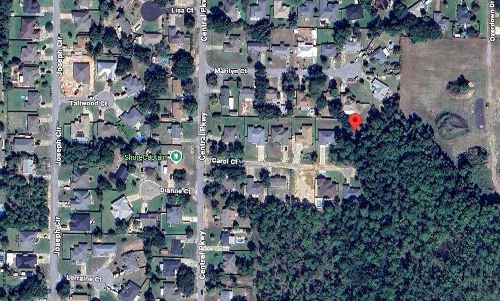Build your dream home on this beautiful wooded lot located in the desirable Santa Rosa Shores East community of Gulf Breeze. Situated on approximately 0.22 acres at the end of a quiet cul-de-sac, this property offers a peaceful setting while remaining conveniently close to schools, shopping, dining, parks, and the stunning Gulf Coast beaches. The lot provides an excellent opportunity for a custom home or investment property in a growing area. Nearby homes feature public water service with septic systems, and paved county-maintained roads provide easy access. Buyer to verify all zoning, land use, utilities, environmental conditions, and building requirements during due diligence. Don't miss this opportunity to own a piece of Florida's beautiful Emerald Coast!