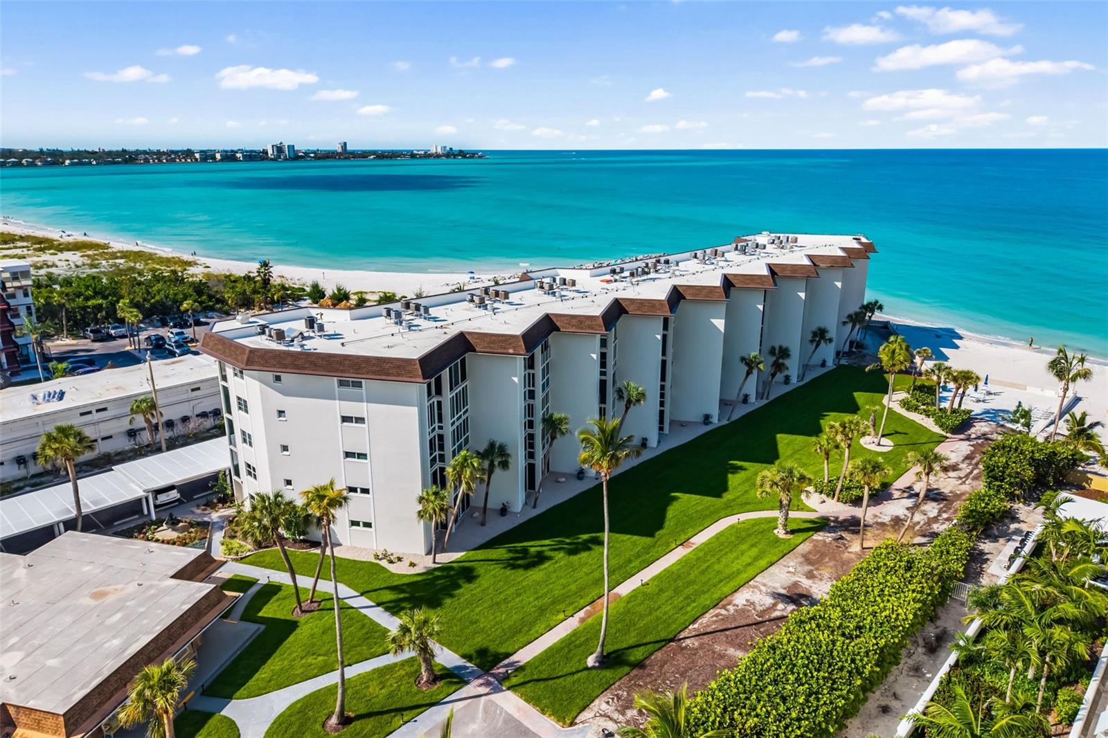 Price Reduced — Affordable Gulf-Front Living on Lido Beach! A rare opportunity to own one of the few true beachfront condos still within reach. This 2-bedroom, 2-bath residence at Lido Harbour South’s Seaview building offers over 1,200 SF of open living with peekaboo Gulf views and a glass-enclosed lanai that becomes your private front-row seat to sunsets and coastal serenity. Impact glass windows, covered parking, and lanai storage add convenience, while the spacious primary suite features an ensuite bath and walk-in closet with flexibility for in-unit laundry. Set within a gated community, residents enjoy private beach access, heated pool, and sunset deck — with all assessments already paid by the sellers. Exciting updates are underway, including a new ADA-compliant elevator, and a restored clubhouse. Just outside the gates, explore Ted Sperling Park’s mangrove tunnels, kayak alongside dolphins, or stroll to the Ritz Tiki Bar and Lido Pavilion. The Bay Runner trolley connects you to St. Armands Circle, and downtown Sarasota’s cultural district is minutes away over the Ringling Bridge. Whether you’re seeking a full-time residence, seasonal escape, or weekend retreat, this Lido Beach gem delivers the Gulf-front lifestyle you’ve dreamed of — at a newly reduced price.
