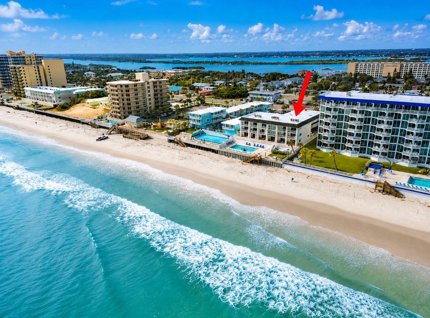 OCEAN VIEW | FULLY REMODELED 2021 | LOW MONTHLY CONDO FEE | SHORT-TERM RENTALS & AIRBNB ALLOWED | FULL-SIZE WASHER & DRYER | HVAC 2021 | WATER HEATER 2025 | PRIVATE GARAGE | HURRICANE SHUTTERS ON BALCONY. Beautifully updated and fully furnished 1-bedroom, 1-bath condo located in the oceanfront community of Curran Shores North. Enjoy ocean views, direct beach access, and a private one-car garage with a new garage door and automatic opener. Remodeled in 2021, this move-in-ready unit features luxury water-resistant flooring, granite countertops, stainless steel appliances, recessed lighting, a hurricane-impact bedroom window, and a full-size washer and dryer. Relax on your private balcony with hurricane shutters and enjoy the coastal breeze. This well-maintained community offers direct beach access and numerous recent improvements including a new roof, new pool, new pavers, new pavement, new stairs, updated seawall, and onsite laundry facilities. Conveniently located near shopping, Publix, the Dunlawton Bridge, and Ponce Inlet. Step outside and enjoy the ultimate beachside lifestyle--your backyard is the beach. Large dogs are welcome. Ideal as an income-producing investment, vacation getaway, second home, or full-time beach residence. All information is deemed reliable but not guaranteed and should be independently verified by buyers and buyers' agents. Measurements are approximate and subject to verification.