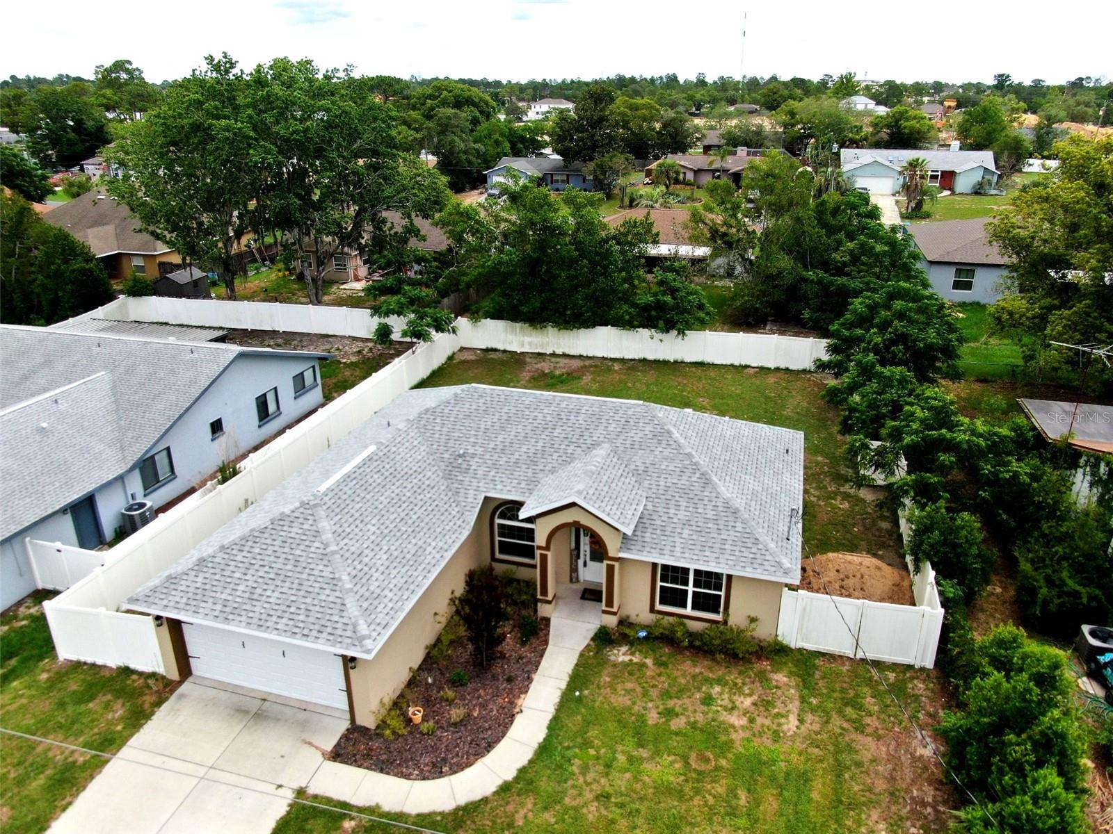Built in 2023 and priced below the seller's original purchase price, this Spring Hill home delivers exceptional value without the wait for new construction. This 3-bedroom, 2-bath, 2-car garage home features 1,396 square feet of modern living space with NO HOA and NO CDD fees!

Inside you'll find stainless steel LG appliances, including a handleless refrigerator and over-the-range microwave, all-wood cabinetry with soft-close drawers, waterproof luxury vinyl plank flooring throughout the main living areas, kitchen, and bathrooms, plus ceiling fans in every room. The bedrooms are carpeted, and the interior laundry room includes a utility sink.

Outside features include a fully sodded yard, front landscaping, and a 12' x 12' rear patio ready for outdoor enjoyment.

Conveniently located near shopping, dining, medical facilities, parks, Weeki Wachee Springs, and the Suncoast Parkway, providing easy access to Tampa and surrounding areas. This home combines the benefits of newer construction with a highly competitive price point in today's market.  Schedule your showing today this one won't last long!