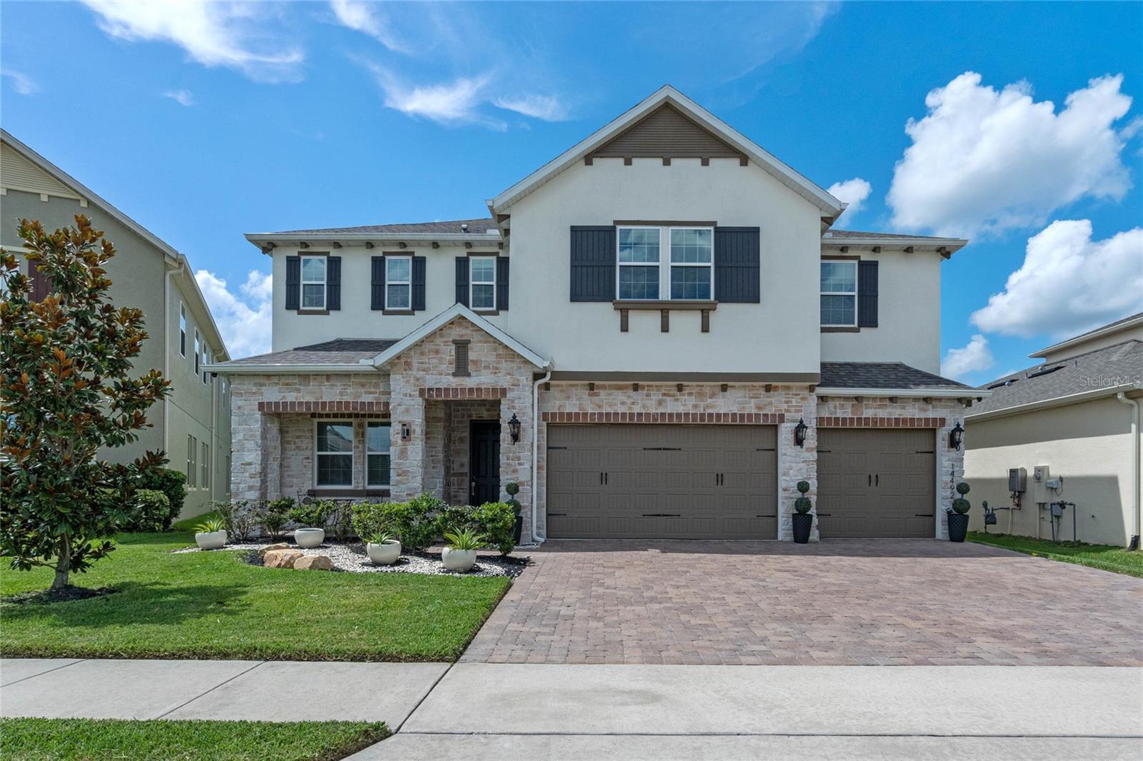 Fully Furnished for Rent for an extra $500 a month. Welcome to the gated community of Bradford Creek in Winter Garden. This luxurious home has 5 bedrooms, 4 bathrooms and a 3-car garage. The kitchen features an over extended island, walk in pantry, 5-burner gas cooktop, top of the line appliances. Enjoy the oversized covered patio with friends and family. Great for entertaining. There are two ensuite bedrooms, one downstairs, and one upstairs, perfect for mother-in-law and/or guests. The downstairs ensuite is hidden behind a custom built secrete door with its private access to the backyard. The master bedroom is huge with 2 walk-in closets and a bathroom features dual rain shower heads. This home is top of the line with all modern accessories like Cat 6 Ethernet, tankless gas water heater, ring camera at front door and smart lights and much more. Come see for yourself.