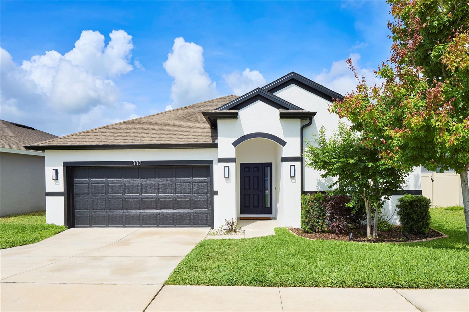 Welcome home to this beautiful 4-bedroom, 2.5-bath residence offering over 1,900 square feet of thoughtfully designed living space. From the moment you arrive, you'll appreciate the fresh interior and exterior paint completed in July 2025, giving the home a clean, modern look. Inside, you'll find a spacious and inviting floor plan featuring shutters throughout and brand-new bedroom flooring installed in July 2025. The kitchen has been tastefully updated with all-new appliances (2025), including a refrigerator, oven, microwave, dishwasher, and a built-in wine fridge—perfect for everyday living and entertaining. Step outside to enjoy the fully fenced backyard, completed in 2024, offering privacy and plenty of space for pets, play, or gatherings. The enclosed back porch (2024) provides additional year-round living space, ideal for relaxing with your morning coffee or hosting guests. A sprinkler system helps keep the lawn lush and easy to maintain, while newly installed gutters (2025) add to the home's value and functionality. Additional highlights include a spacious two-car garage, generous living areas, and numerous recent upgrades that make this home truly move-in ready. With modern improvements, timeless finishes, and plenty of space for family and friends, this exceptional property is ready to welcome you home.
