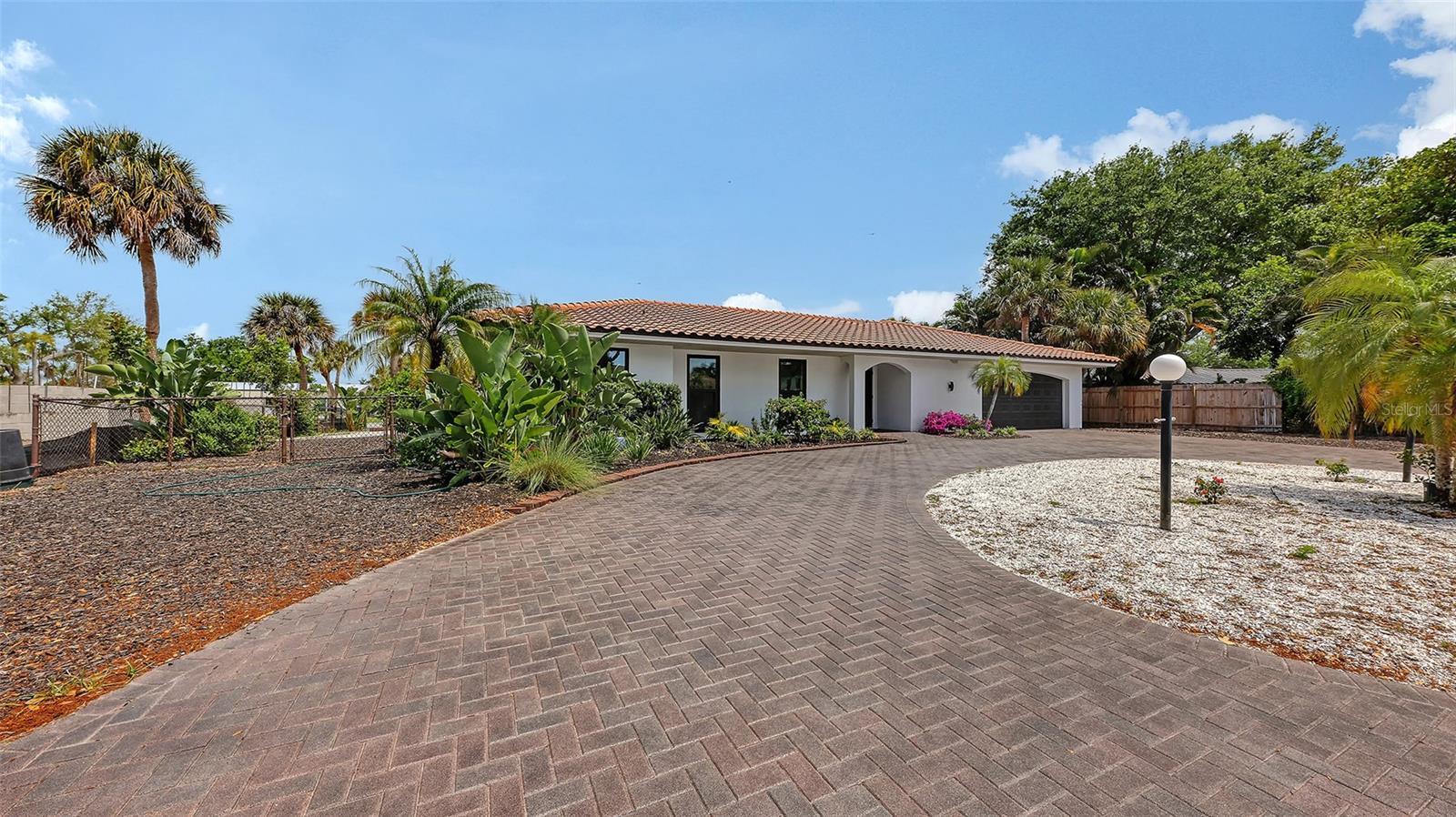 Welcome to your canal front pool home on beautiful Siesta Key.  It is a 4 bedroom,2 full bathroom home on approximately .24 acres (10,623 sq ft).It was built in 1972 and now rebuilt in 2026. The house is 2,154 sq ft under air with a 2 car garage which is 462 sq ft. There are brand new Champion windows and sliders,throughout all  hurricane impact resistant. The new HVAC system was put in in 2024, and since then the electric and plumbing systems were totally redone. The brand new flooring is a  beautiful sandy tile, much like the color of the sand  on world renowned Siesta Key beach. Take invigorating walks or bike rides and view the magnificent sunsets on the beach. The roof is older but has been inspected and is in excellent condition. There are lots of plush plantings and a dock right outside of the screened pool and lanai. Come see for yourself! This home should not be missed! Buy yourself a piece of paradise, there's only so much to go around!