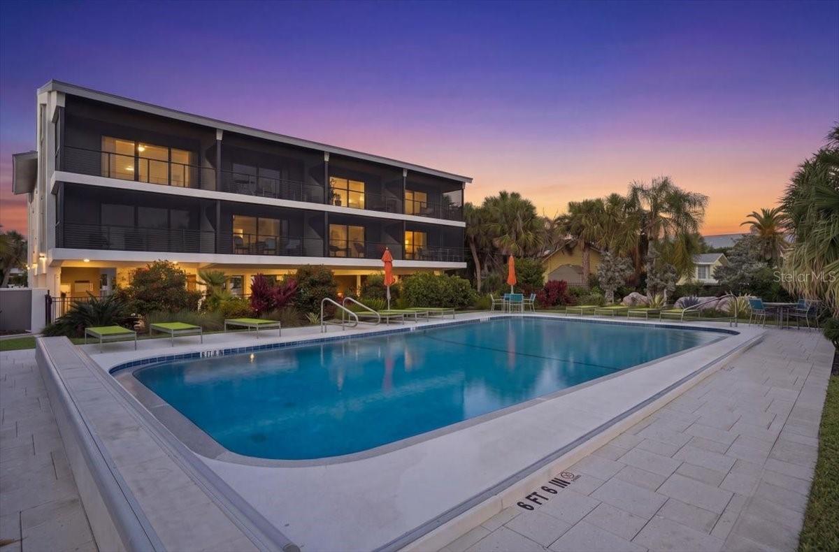 Escape to your own slice of paradise on Anna Maria Island in this rare corner unit tucked away on a wonderfully quiet street within an exclusive gulf front complex of only 16 residences split between two buildings. The bright and inviting layout flows effortlessly across an open kitchen dining and living room area creating a spacious relaxed vibe that is just perfect for entertaining or unwinding after a day in the sun. It comes completely furnished with comfortable coastal decor so you can move right in and start enjoying the beach lifestyle from day one, while the kitchen is fully equipped with stainless steel appliances and a handy breakfast bar for casual morning coffee. Step through the wide sliding glass doors onto your large balcony to catch the cool coastal breezes and take in the gulf views overlooking the water. With most of the units serving as second homes, the entire complex remains incredibly quiet and the outdoor amenities are rarely occupied by everyone at once, offering you a truly peaceful and private escape. The property features beautifully updated exteriors surrounded by lush landscape that instantly makes you feel like you are staying at a hidden luxury resort, and between the premier island location, the massive oversized pool, and the convenience of covered parking with your own dedicated space, this beachside retreat offers everything you need for the ultimate island getaway.